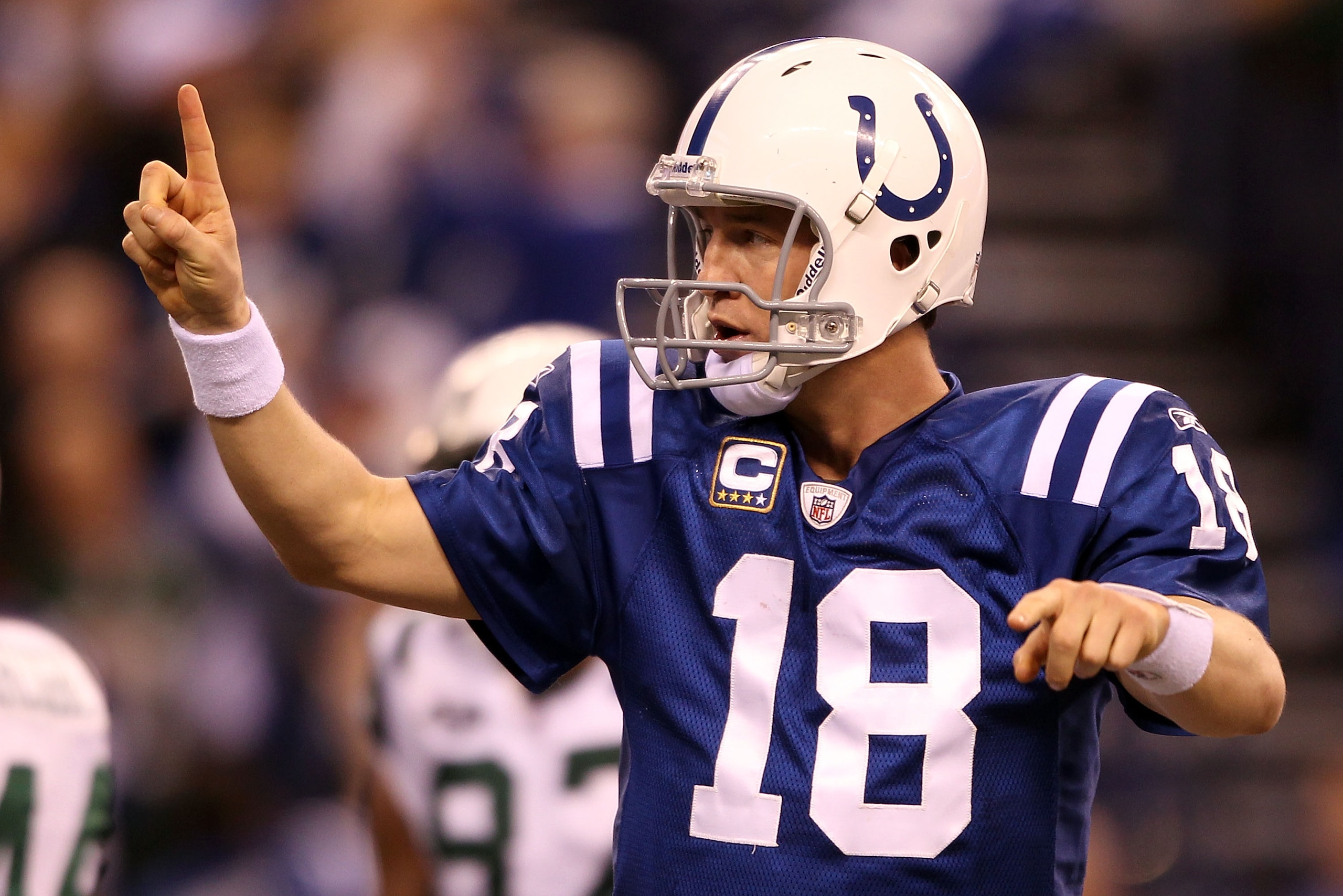INDIANAPOLIS - JANUARY 24:  Quarterback Peyton Manning #18 of the Indianapolis Colts reacts after throwing a 16-yard touchdown pass to Austin Collie #17 in the second quarter against the New York Jets during the AFC Championship Game at Lucas Oil Stadium