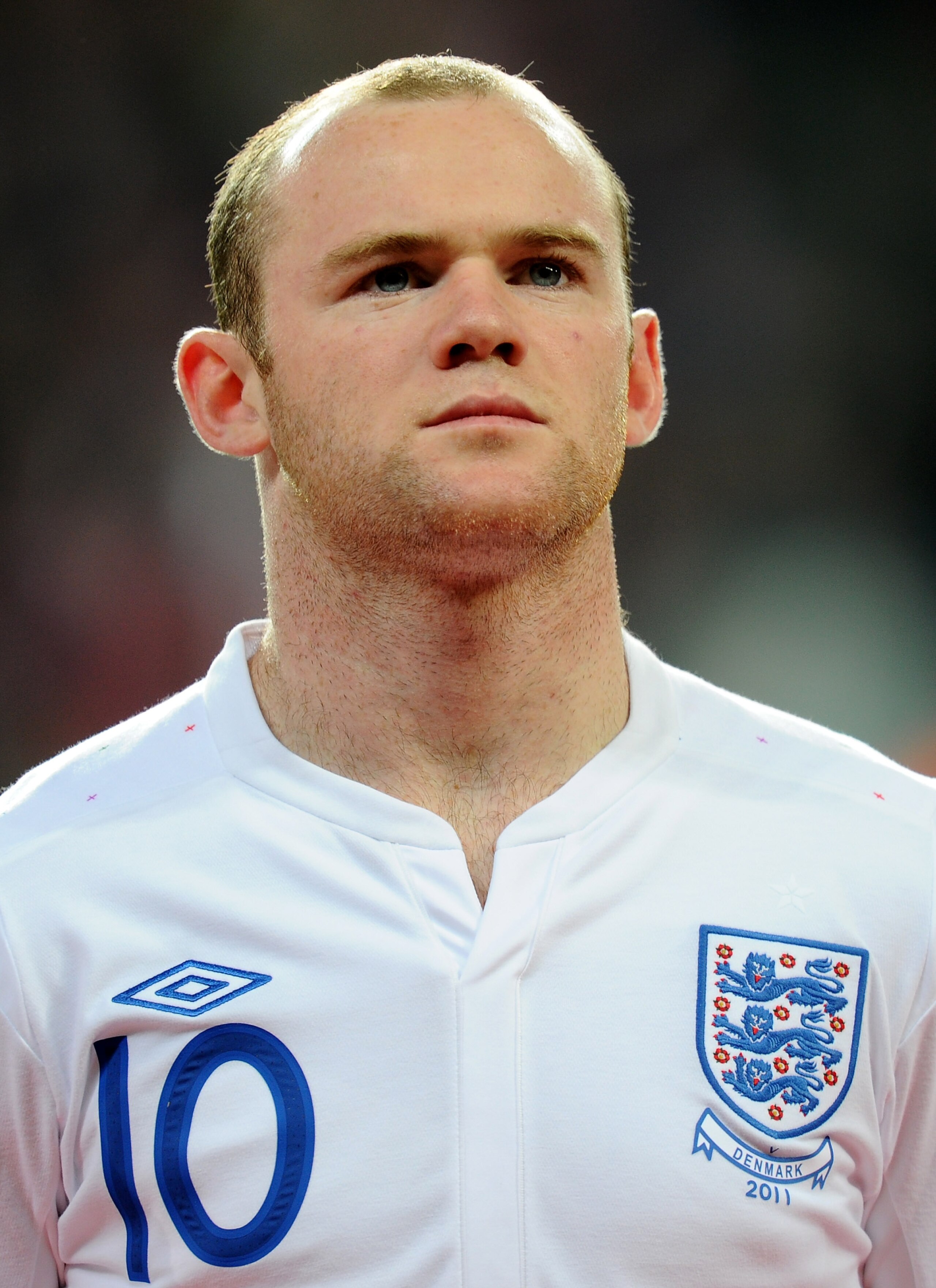 COPENHAGEN, DENMARK - FEBRUARY 09:  Wayne Rooney of England stands for the national anthems prior to the International Friendly match between Denmark and England at Parken Stadium on February 9, 2011 in Copenhagen, Denmark.  (Photo by Mike Hewitt/Getty Im