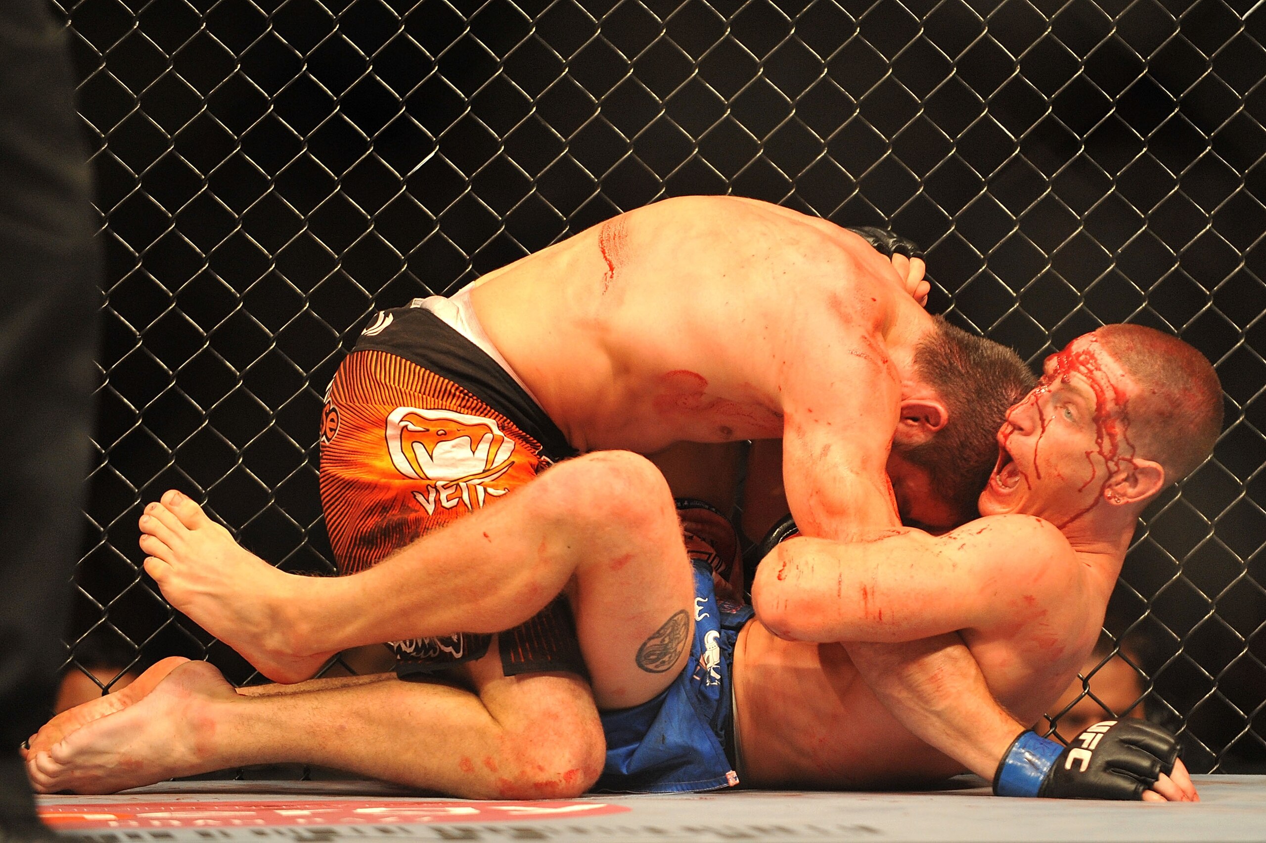 LAS VEGAS - JULY 11:  (Top) Jim Miller battles Mac Danzig during their lightweight bout during UFC 100 on July 11, 2009 in Las Vegas, Nevada. Miller defeated Danzig by unanimous decision.  (Photo by Jon Kopaloff/Getty Images)