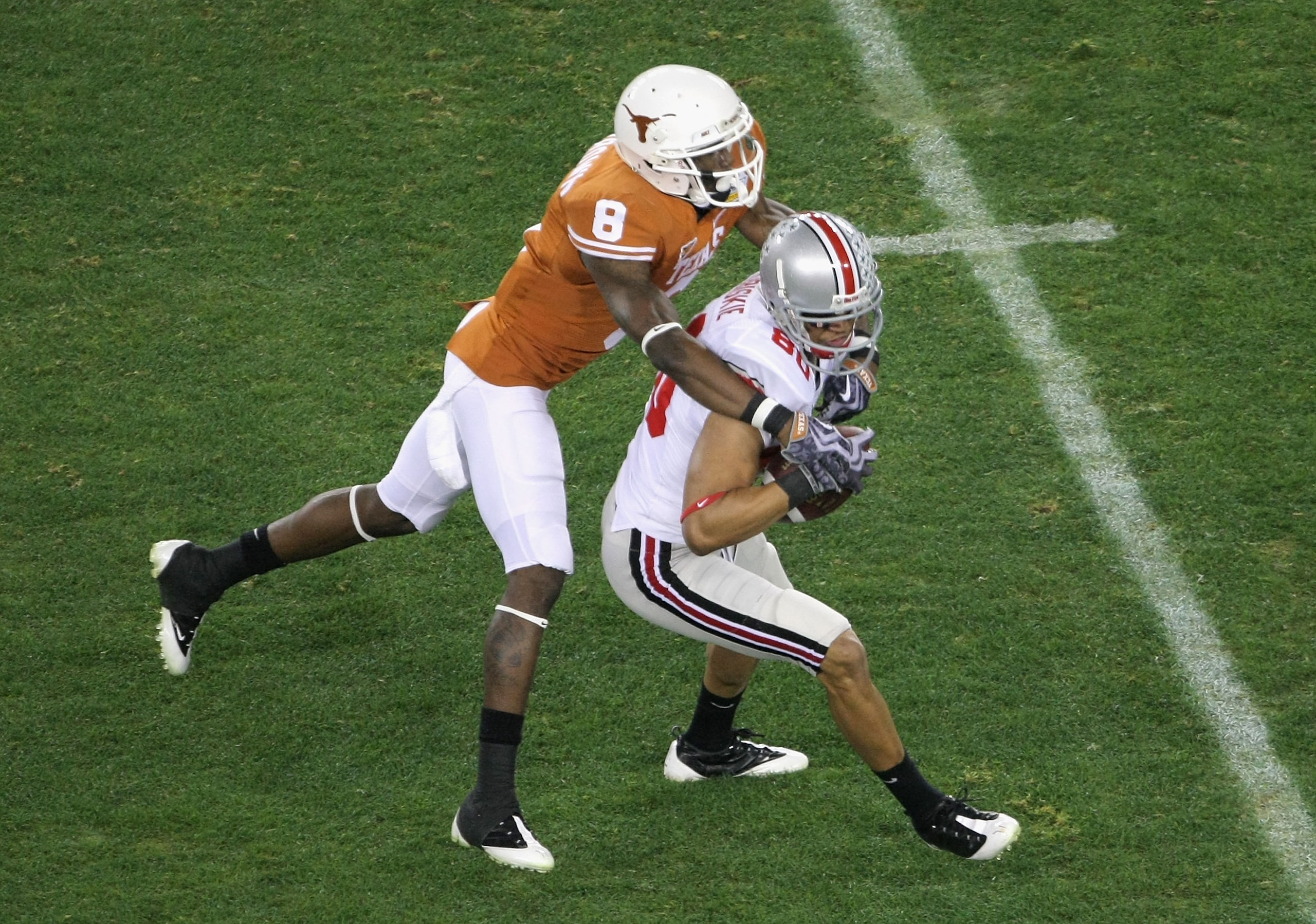 GLENDALE, AZ - JANUARY 05:  Wide receiver Brian Robiskie #80 of the Ohio State Buckeyes catches a 14 yard reception under pressure from Chykie Brown #8 of the Texas Longhorns during the Tostitos Fiesta Bowl Game on January 5, 2009 at University of Phoenix