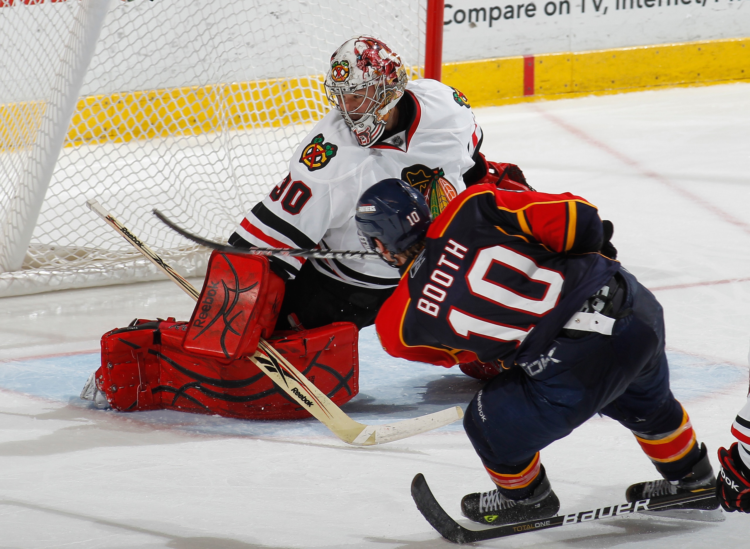 SUNRISE, FL - MARCH 8: Goaltender Marty Turco #30 of the Chicago Blackhawks stops a shot by David Booth #10 of the Florida Panthers on March 8, 2011 at the BankAtlantic Center in Sunrise, Florida. The Panthers defeated the Blackhawks 3-2. (Photo by Joel A