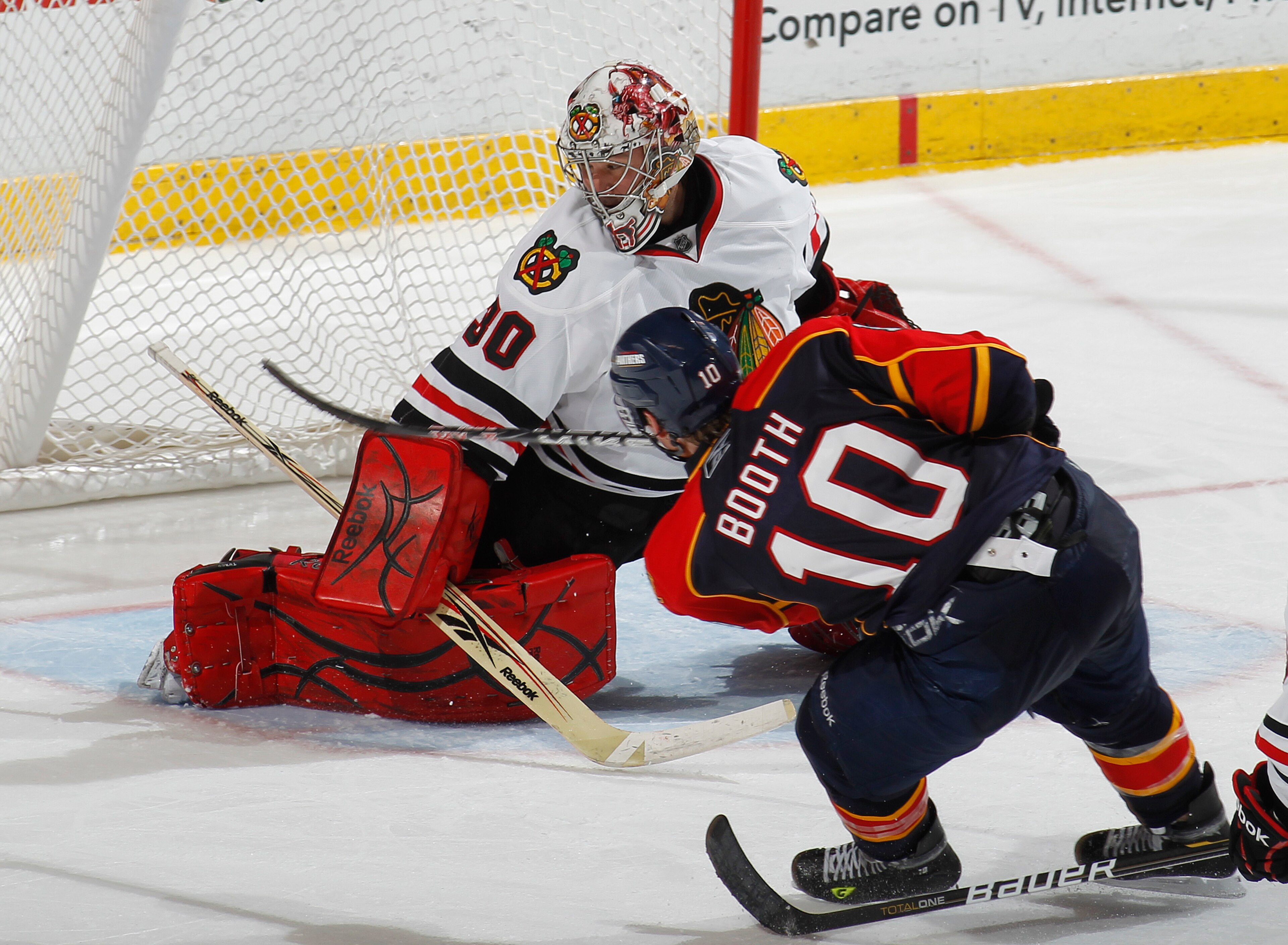 SUNRISE, FL - MARCH 8: Goaltender Marty Turco #30 of the Chicago Blackhawks stops a shot by David Booth #10 of the Florida Panthers on March 8, 2011 at the BankAtlantic Center in Sunrise, Florida. The Panthers defeated the Blackhawks 3-2. (Photo by Joel A