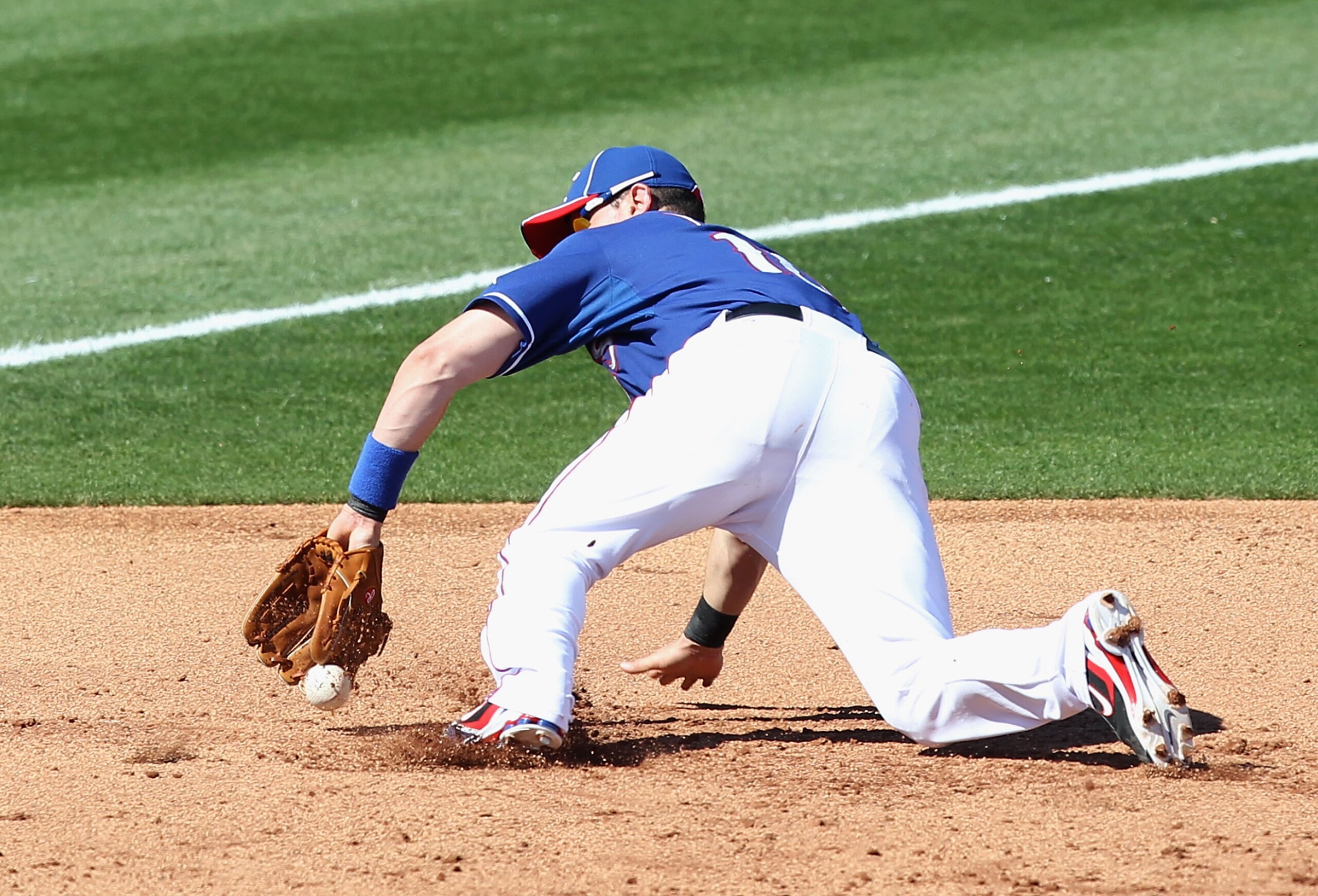 SURPRISE, AZ - MARCH 02:  Infielder Michael Young #10 of the Texas Rangers during the spring training game against the Los Angeles Angels of Anaheim at Surprise Stadium on March 2, 2011 in Surprise, Arizona.  (Photo by Christian Petersen/Getty Images)