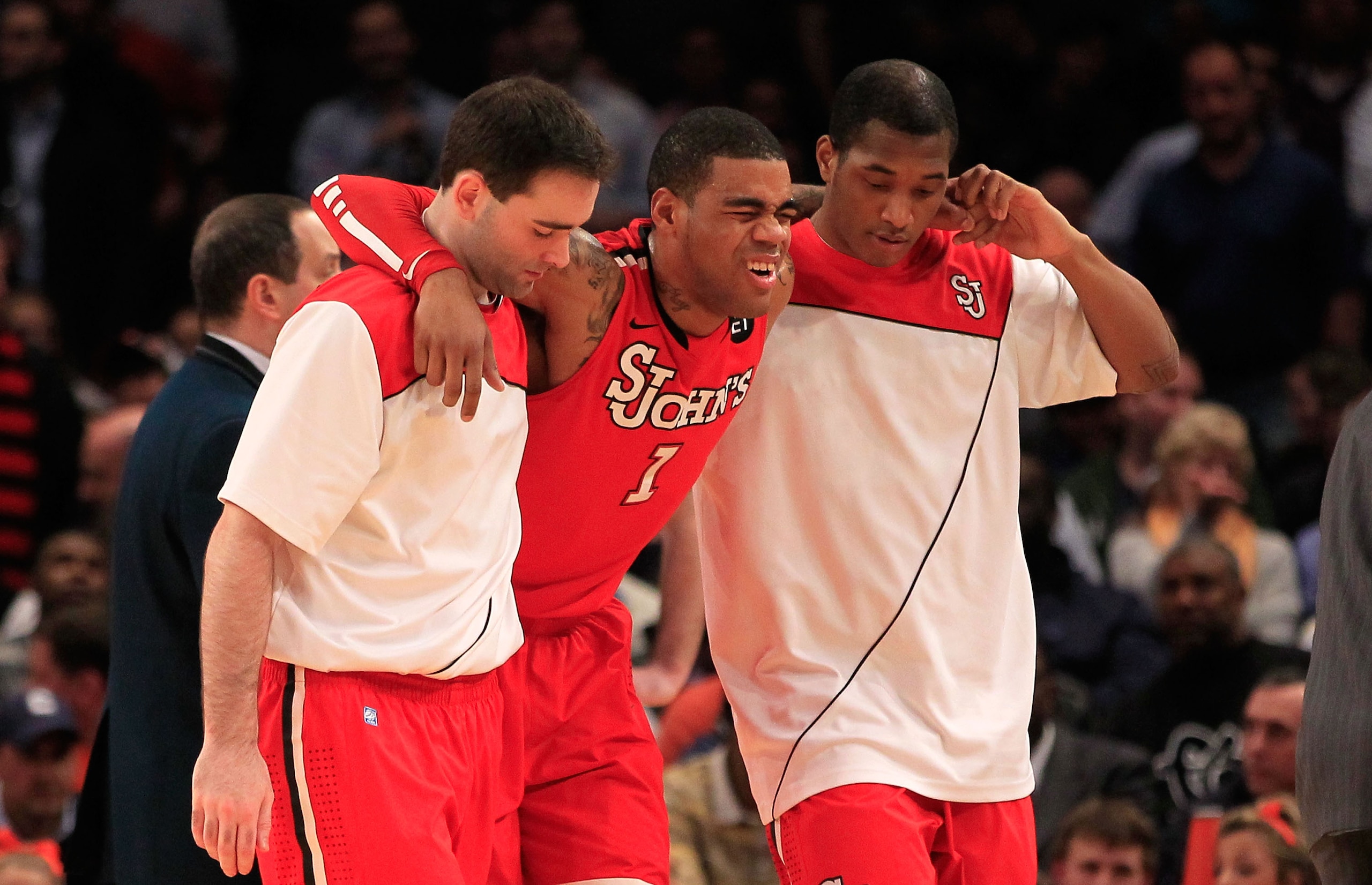 NEW YORK, NY - MARCH 10: D.J. Kennedy #1 of the St. John's Red Storm is helped off the court after being injured in the first half against the Syracuse Orange during the quarterfinals of the 2011 Big East Men's Basketball Tournament presented by American NEW YORK, NY - MARCH 10: D.J. Kennedy #1 of the St. John's Red Storm is helped off the court after being injured in the first half against the Syracuse Orange during the quarterfinals of the 2011 Big East Men's Basketball Tournament presented by American