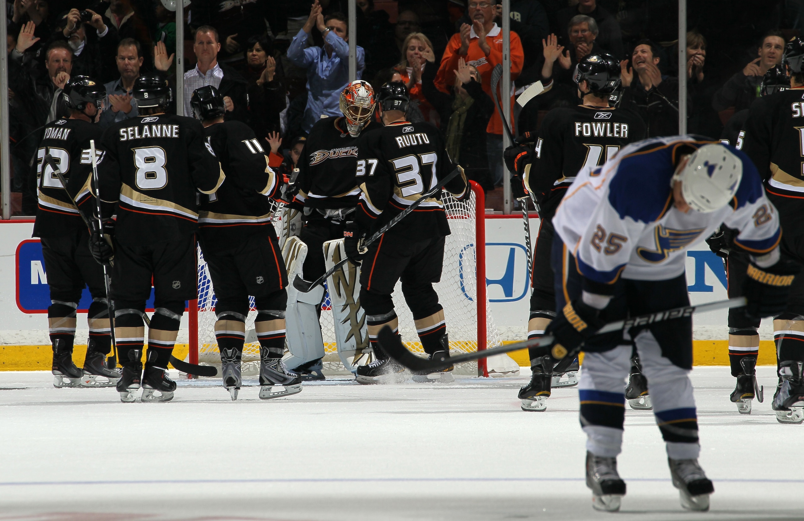 ANAHEIM, CA - MARCH 16:  Goalie Ray Emery #29 and Ryan Getzlaf #15 of the Anaheim Ducks celebrate weith teammates as Chirs Stewart #25 of the St. Louis Blues skates off the ice after their game at Honda Center on March 16, 2011 in Anaheim, California.  An