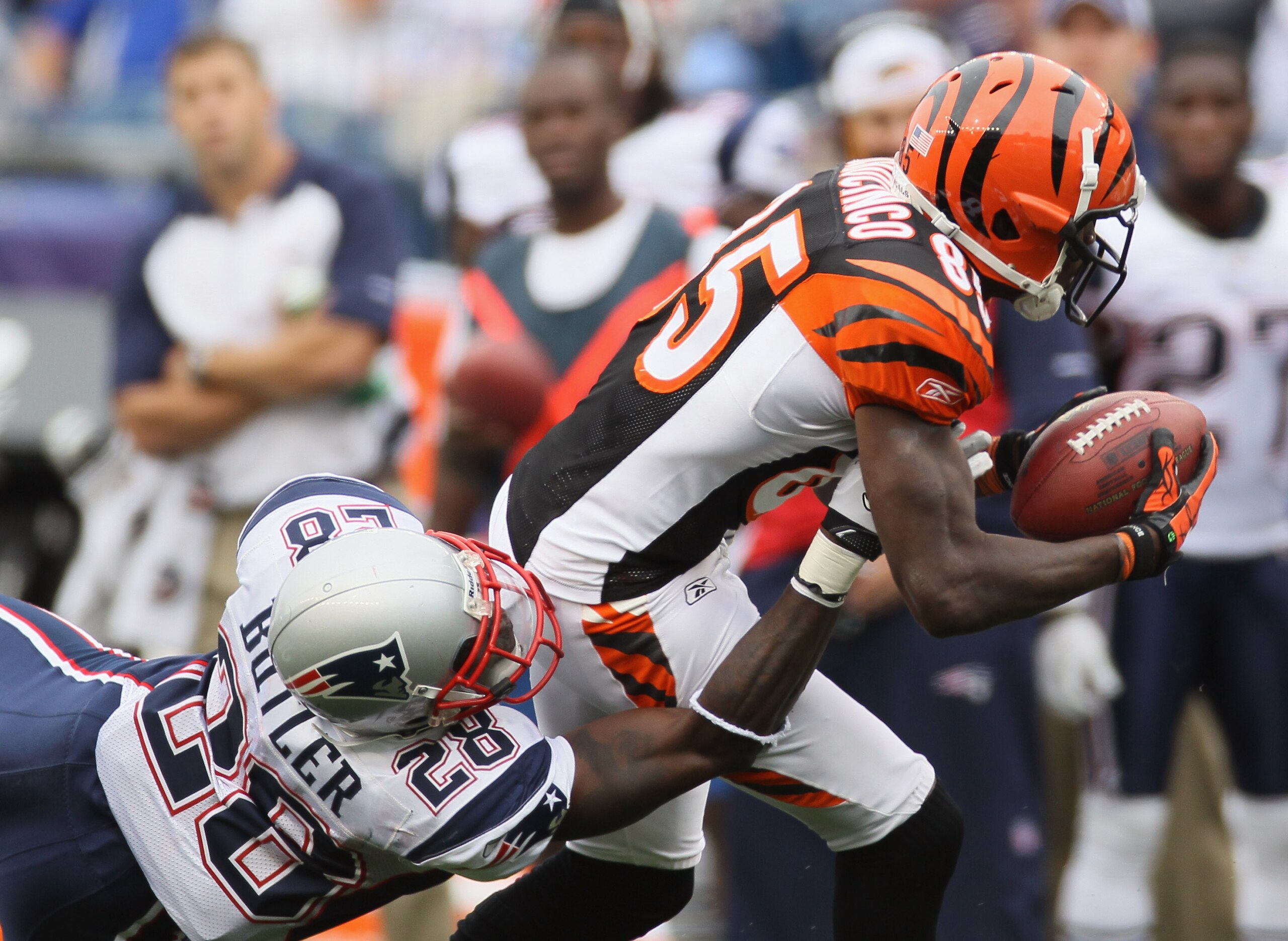 FOXBORO, MA - SEPTEMBER 12:  Chad Ochocinco #85 of the Cincinnati Bengals makes the catch as Darius Butler #28 of the New England Patriots defends during the NFL season opener on September 12, 2010 at Gillette Stadium in Foxboro, Massachusetts. The Patrio