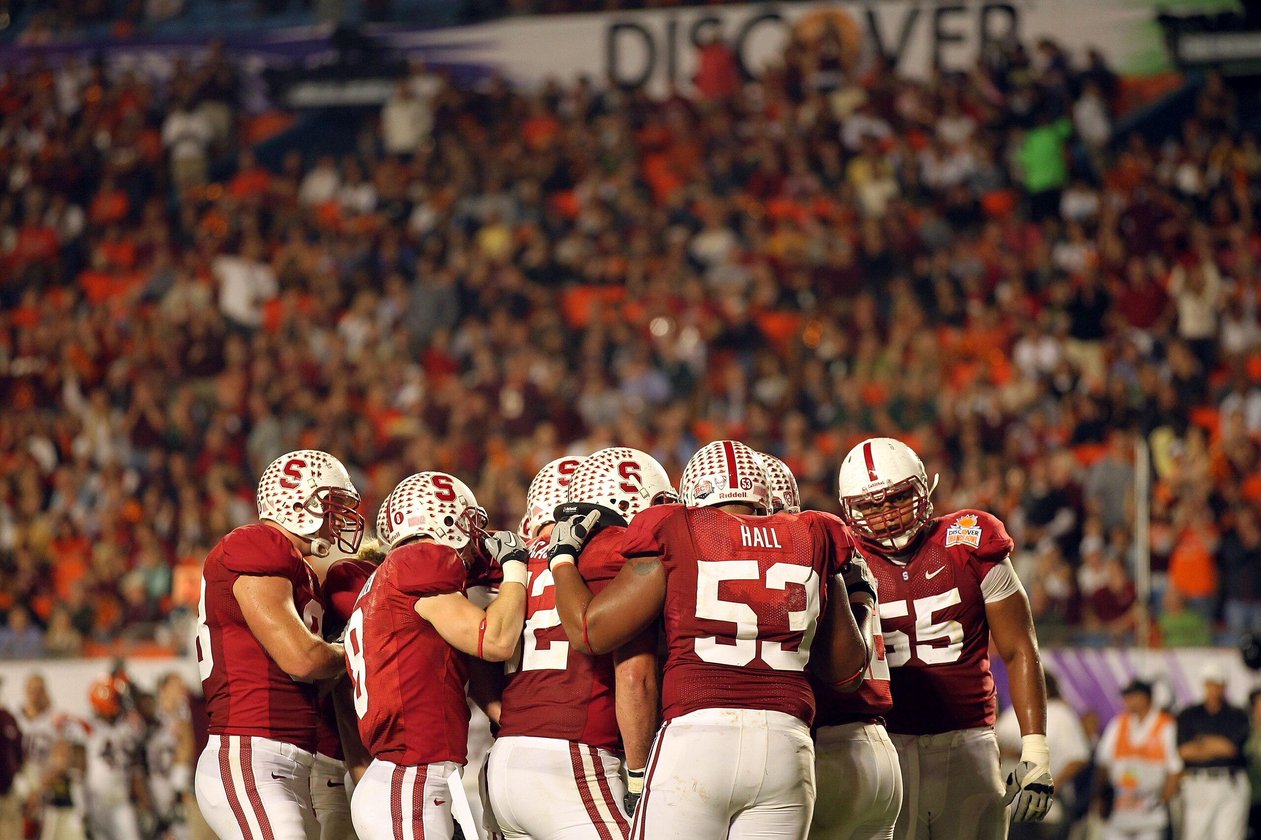MIAMI, FL - JANUARY 03:  The Stanford Cardinal offense stands in a huddle against the Virginia Tech Hokies during the 2011 Discover Orange Bowl at Sun Life Stadium on January 3, 2011 in Miami, Florida.  (Photo by Mike Ehrmann/Getty Images)
