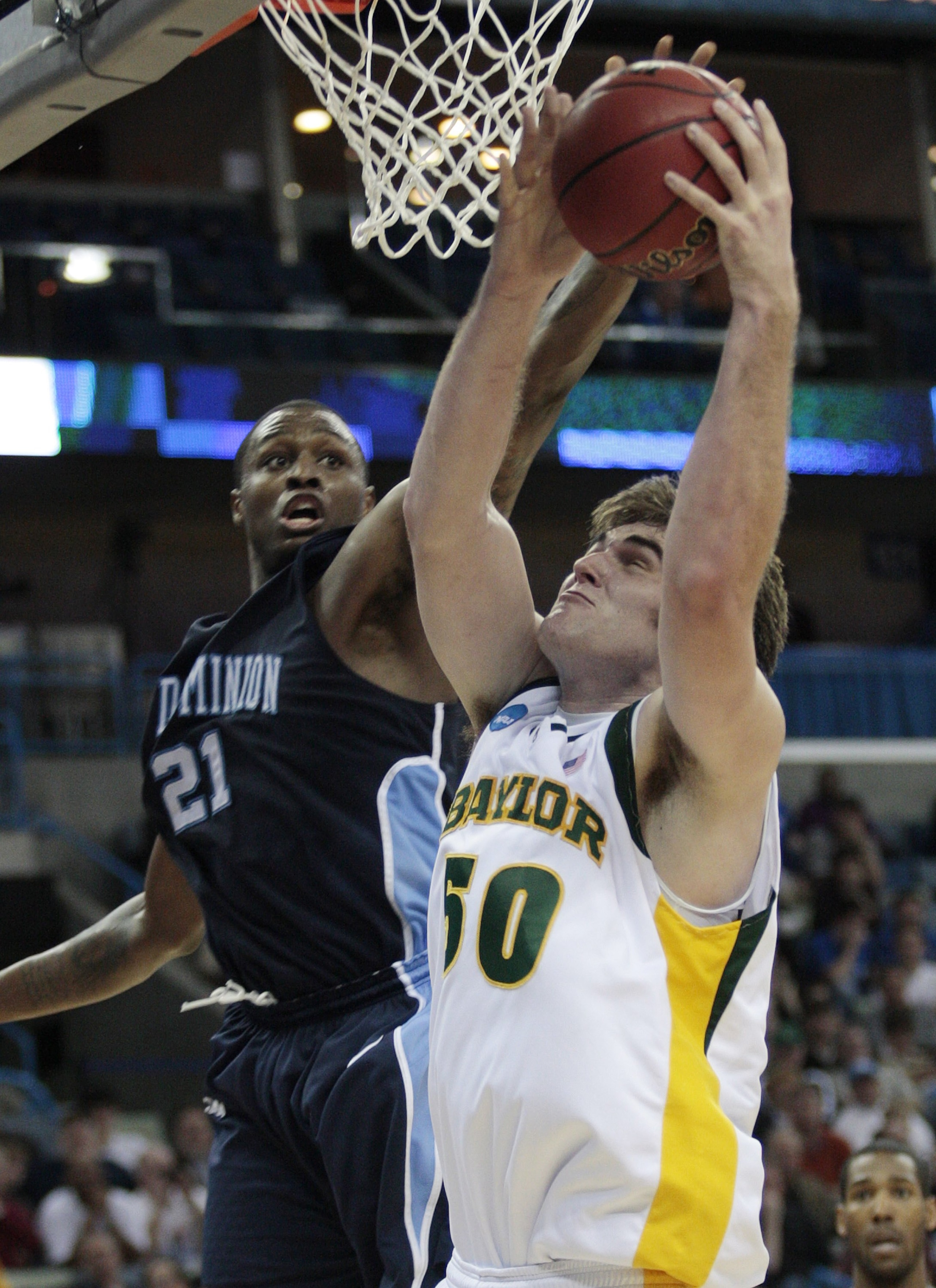 NEW ORLEANS - MARCH 20:  Josh Lomers #50 of the Baylor Bears fights Frank Hassell #21 of the Old Dominion Monarchs during the second round of the 2010 NCAA men's basketball tournament at the New Orleans Arena on March 20, 2010 in New Orleans, Louisiana.