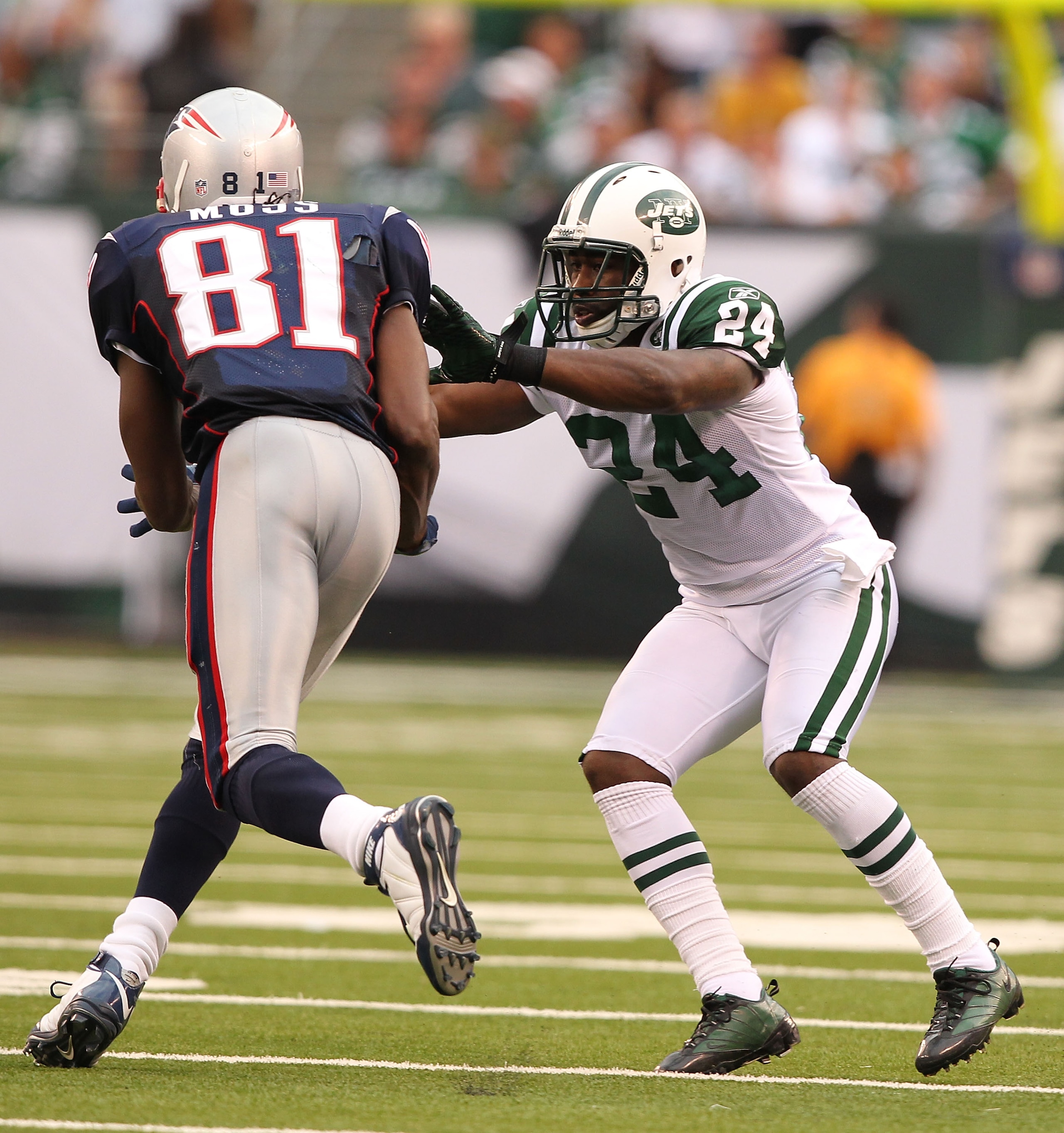EAST RUTHERFORD, NJ - SEPTEMBER 19:  Darrelle Revis #24 of the New York Jets defends against Randy Moss #81 of the New England Patriots during their  game on September 19, 2010 at the New Meadowlands Stadium  in East Rutherford, New Jersey.  (Photo by Al 