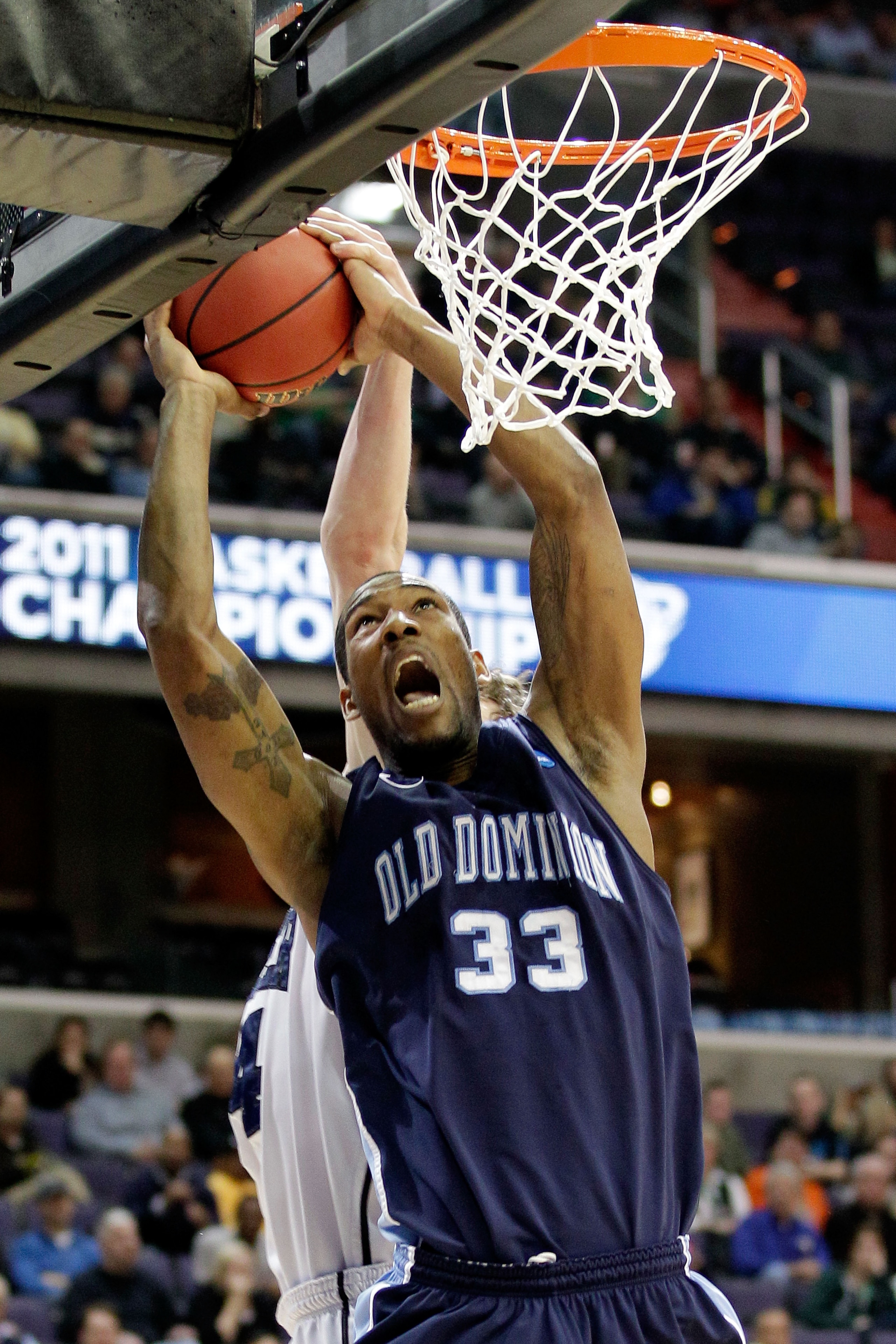 WASHINGTON - MARCH 17:  Keyon Carter #33 of the Old Dominion Monarchs goes up for a shot against the Butler Bulldogs during the second round of the 2011 NCAA men's basketball tournament at the Verizon Center on March 17, 2011 in Washington, DC.  (Photo by