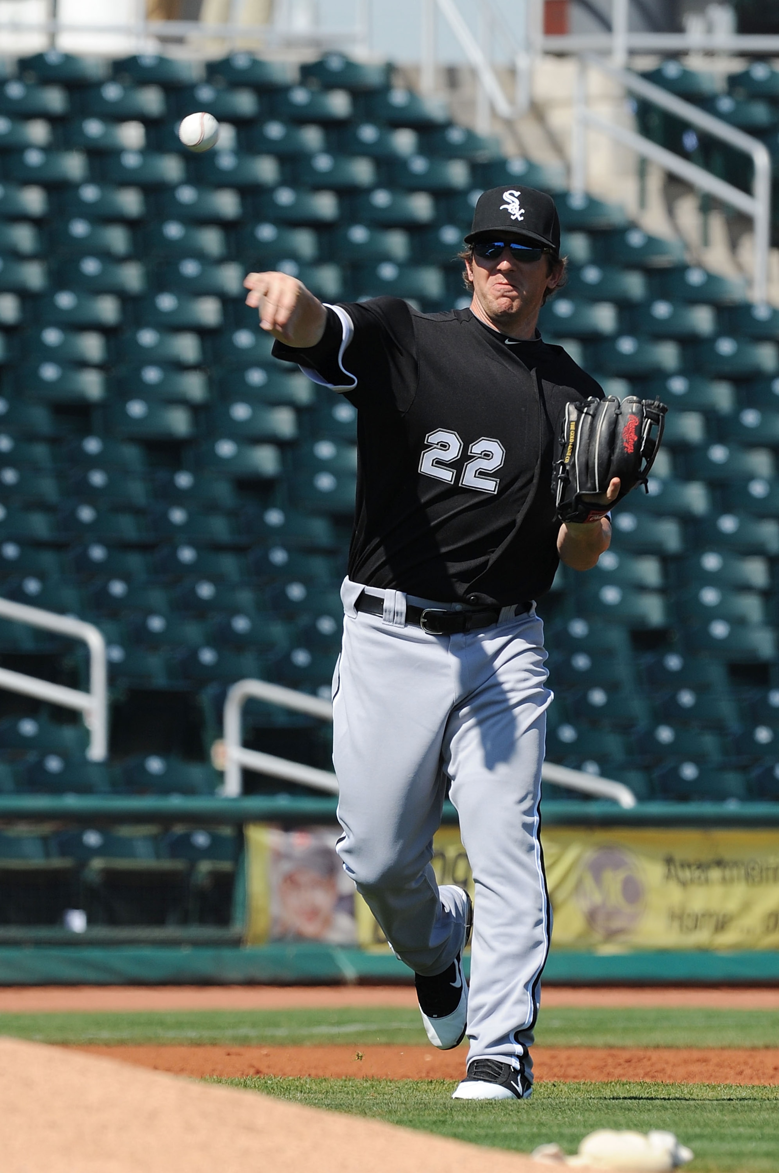 GOODYEAR, AZ - MARCH 02:  Brent Morel #22 of the Chicago White Sox throws the ball to first base against the Cincinnati Reds at Goodyear Ballpark on March 2, 2011 in Goodyear, Arizona.  (Photo by Norm Hall/Getty Images)