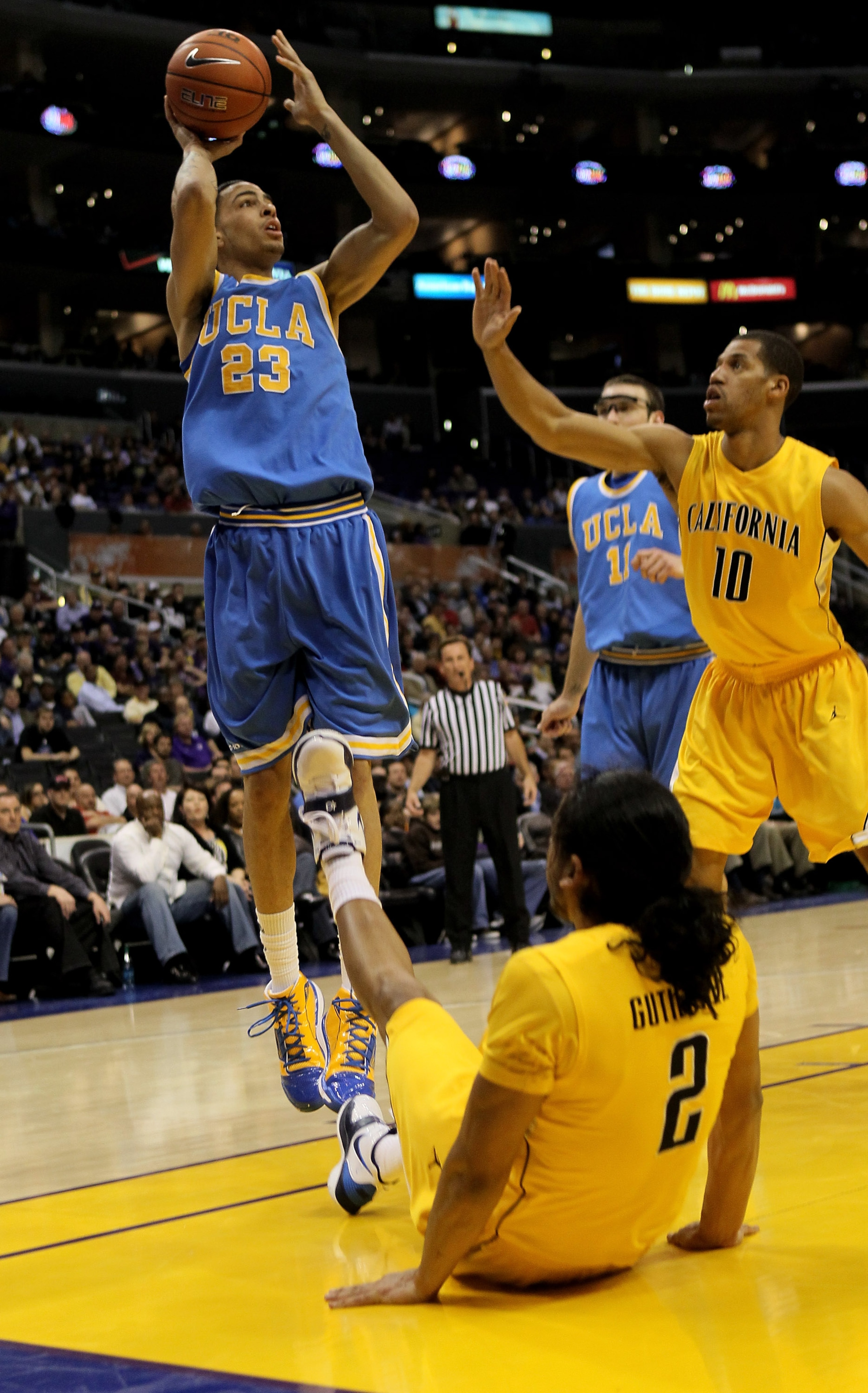 LOS ANGELES - MARCH 12:  Tyler Honeycutt #23 of the UCLA Bruins shoots over Jamal Boykin #10 and Jorge Gutierrez #2 of the California Golden Bears during the semifinals of the Pac-10 Basketball Tournament at Staples Center on March 12, 2010 in Los Angeles