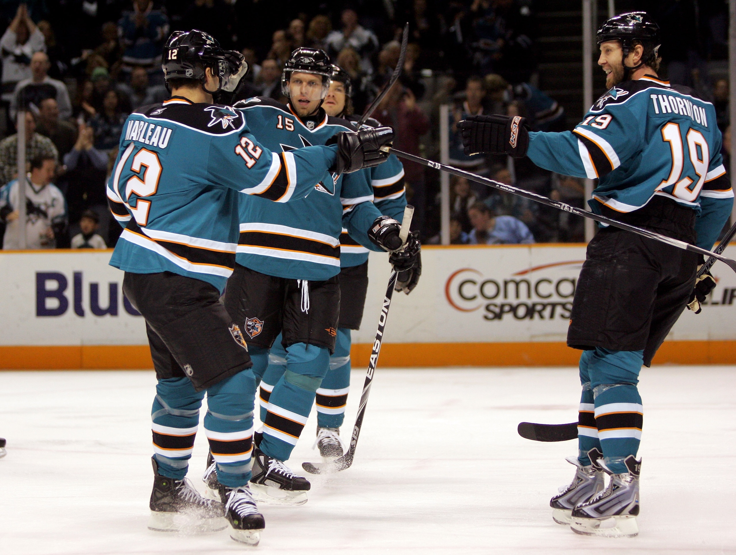 SAN JOSE, CA - JANUARY 16:  Dany Heatley #15 of the San Jose Sharks is congratulated by teammates Patrick Marleau #12 and Joe Thornton #19 after he scored a goal in the first period of their game against the Edmonton Oilers at HP Pavilion on January 16, 2