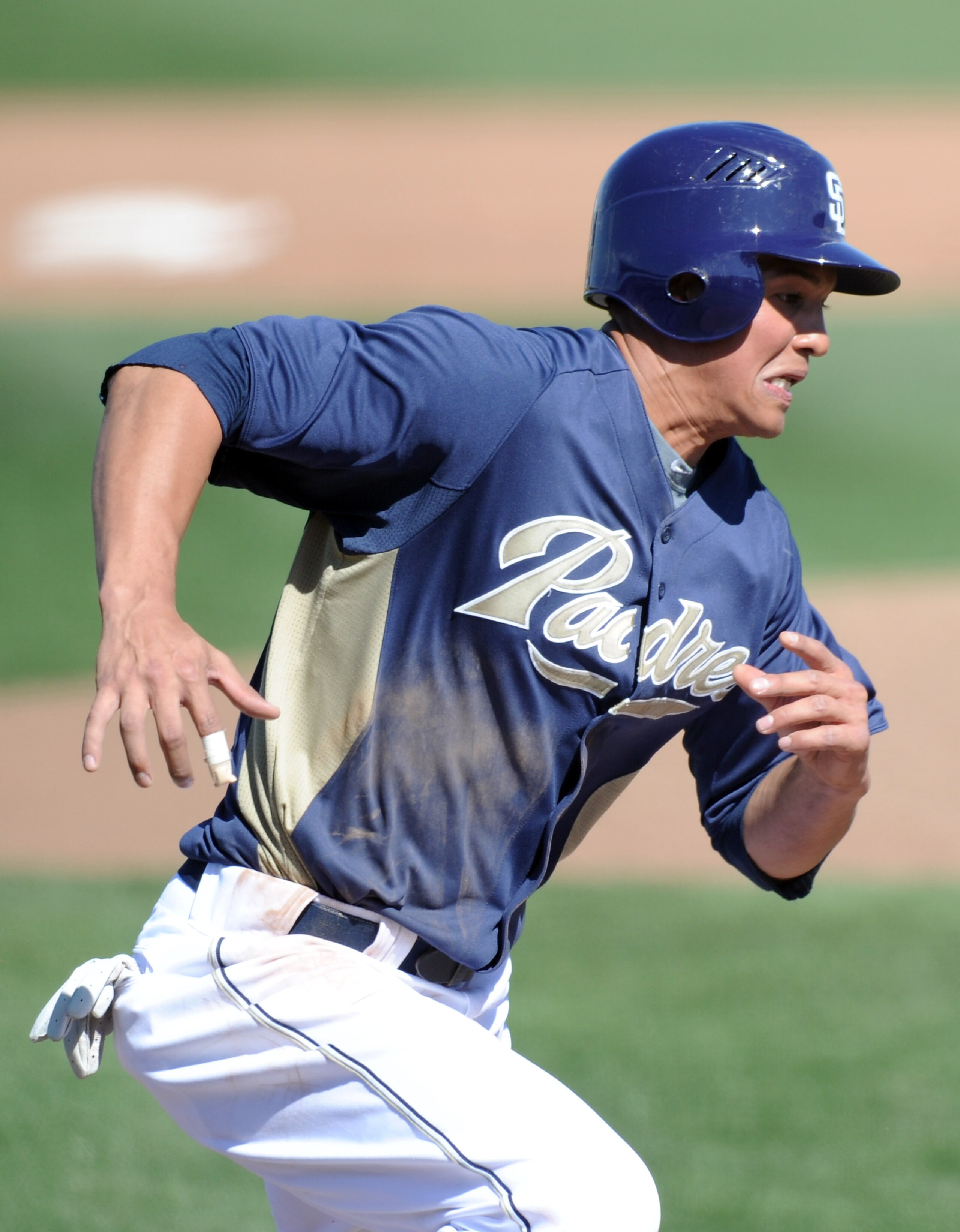 PEORIA, AZ - MARCH 02: Will Venable #25 of the San Diego Padres runs home against the Colorado Rockies during spring training at Peoria Stadium on March 2, 2011 in Peoria, Arizona.  (Photo by Harry How/Getty Images)
