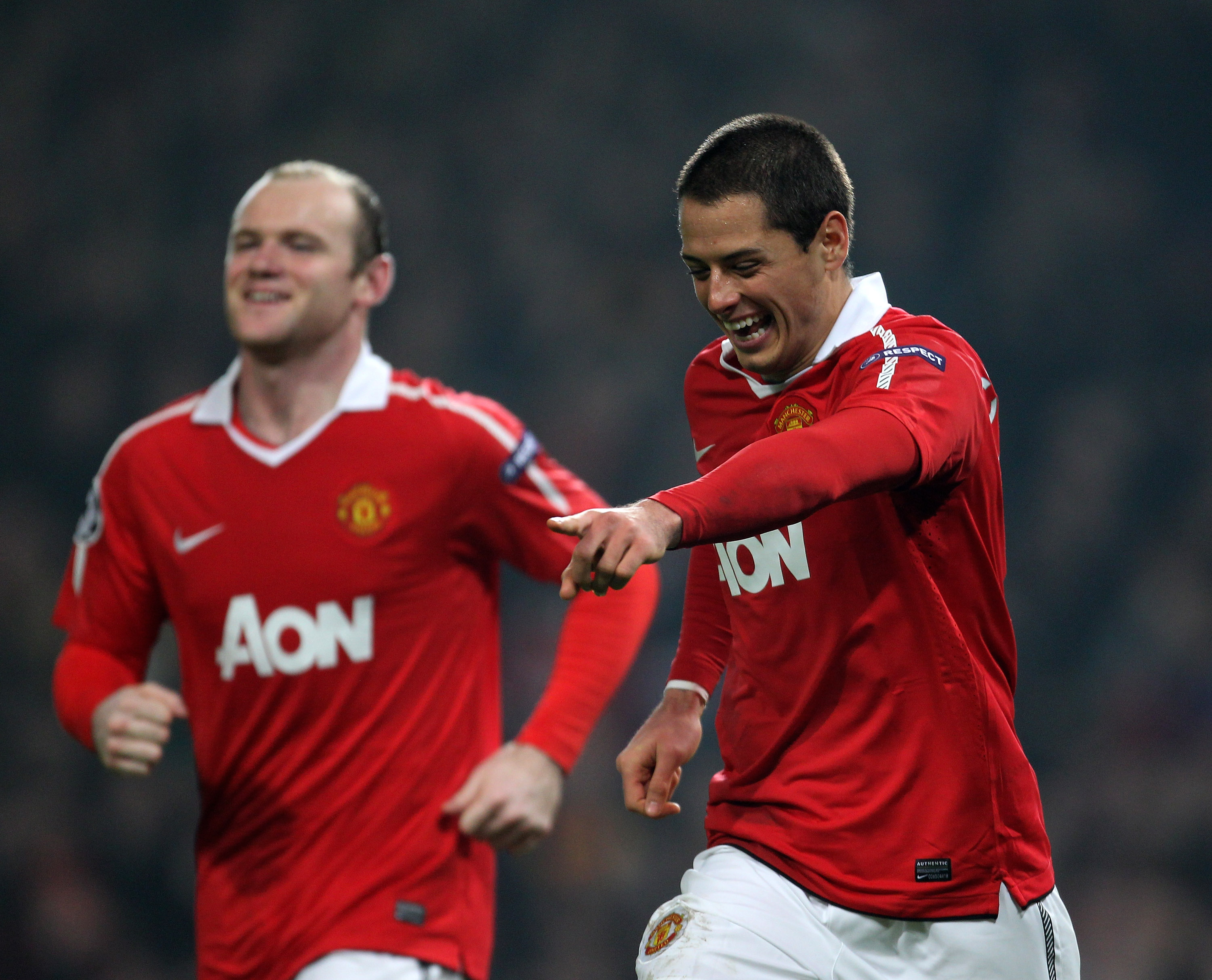 MANCHESTER, ENGLAND - MARCH 15:  Javier Hernandez (R) of Manchester United celebrates with teammate Wayne Rooney (L) as he scores the second goal during the UEFA Champions League round of 16 second leg match between Manchester United and Marseille at Old