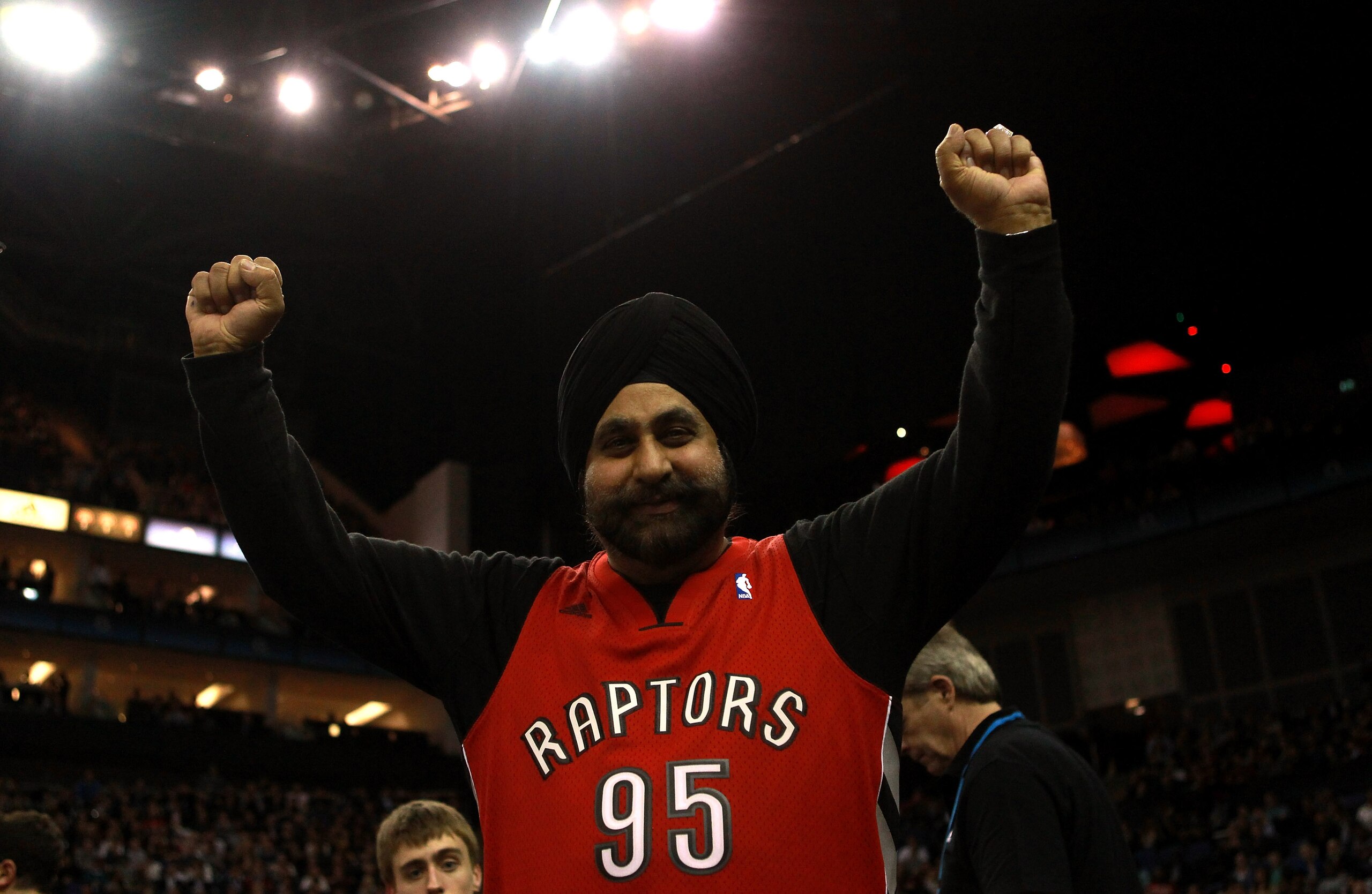 LONDON, ENGLAND - MARCH 04: A Raptors fans cheers on his team during the NBA match between New Jersey Nets and the Toronto Raptors at the O2 Arena on March 4, 2011 in London, England. NOTE TO USER: User expressly acknowledges and agrees that, by download LONDON, ENGLAND - MARCH 04: A Raptors fans cheers on his team during the NBA match between New Jersey Nets and the Toronto Raptors at the O2 Arena on March 4, 2011 in London, England. NOTE TO USER: User expressly acknowledges and agrees that, by download