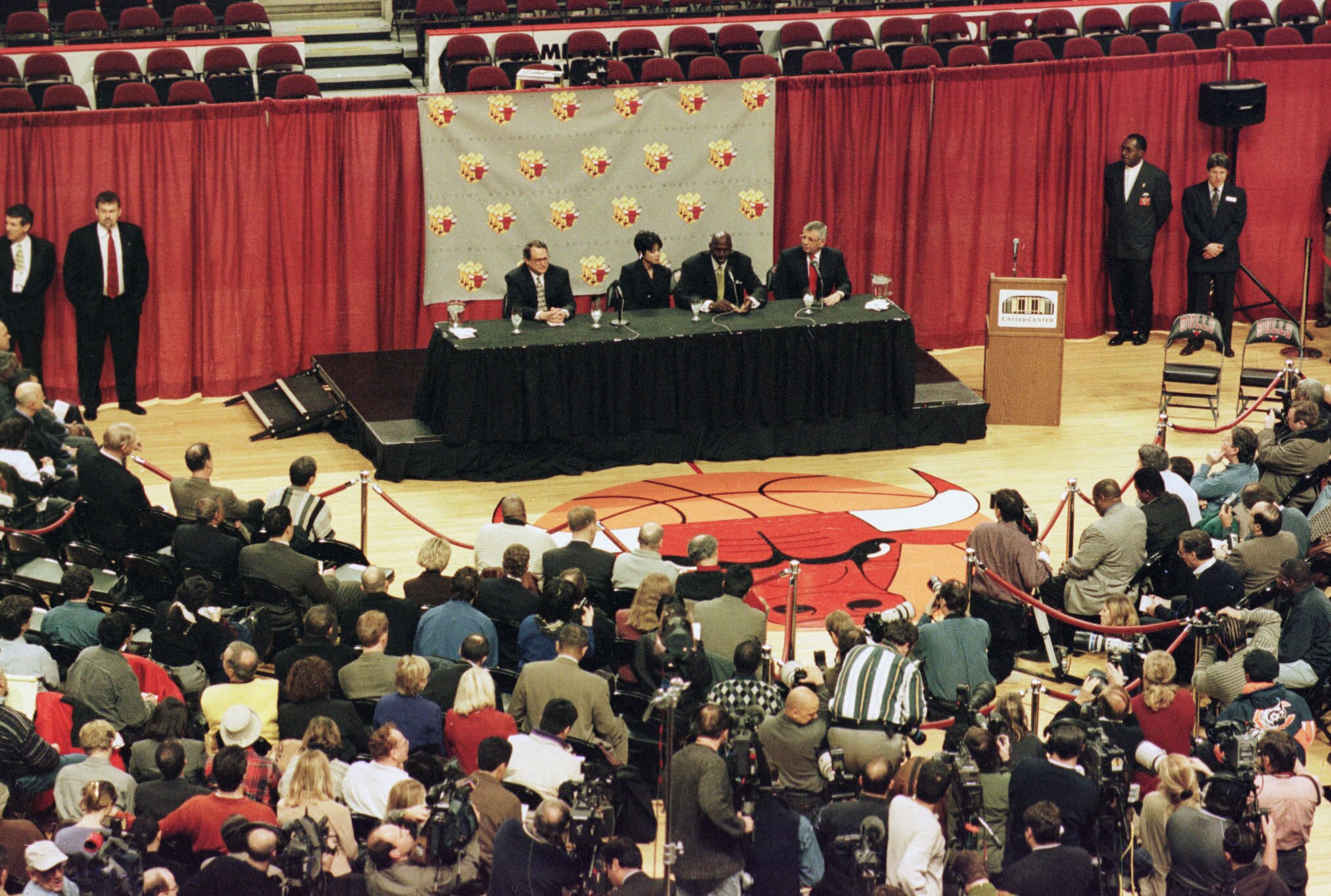 13 Jan 1999:  The media are gathered on the floor of the basketball court as Michael Jordan of the Chicago Bulls announces his retirement from the NBA during a press conference at the United Center in Chicago, Illinois. Mandatory Credit: Matthew Stockman/