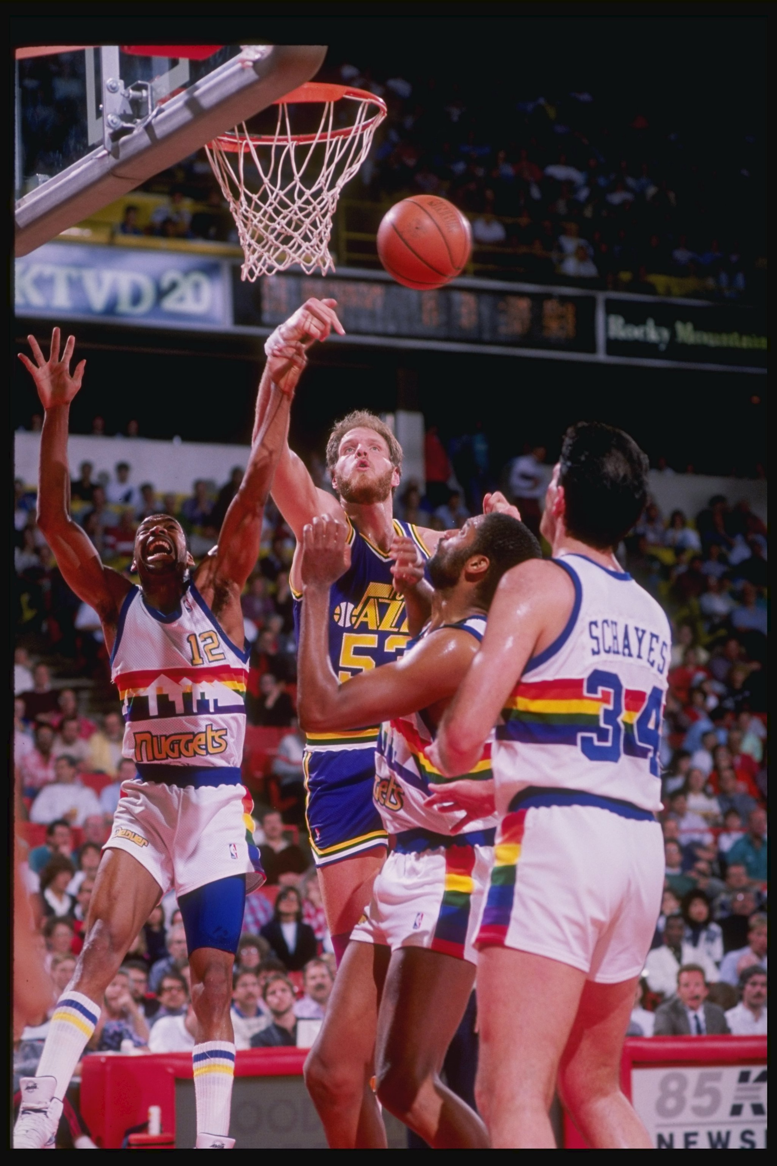 1989-1990: Center Mark Eaton of the Utah Jazz (center) in action during a game against the Denver Nuggets at McNichols Arena in Denver, Colorado. Mandatory Credit: Tim de Frisco /Allsport 1989-1990: Center Mark Eaton of the Utah Jazz (center) in action during a game against the Denver Nuggets at McNichols Arena in Denver, Colorado. Mandatory Credit: Tim de Frisco /Allsport