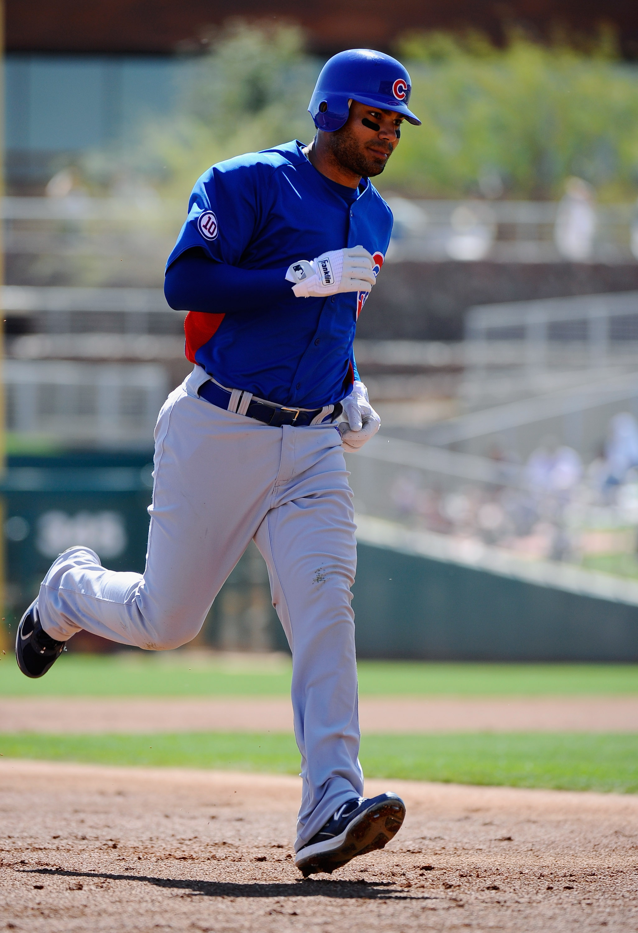 GLENDALE, AZ - MARCH 11:  Carlos Pena #22 of the Chicago Cubs circle the bases aftet a hitting a one run home run against the Chicago White Sox during the second inning of the spring training baseball game at Camelback Ranch on March 11, 2011 in Glendale,