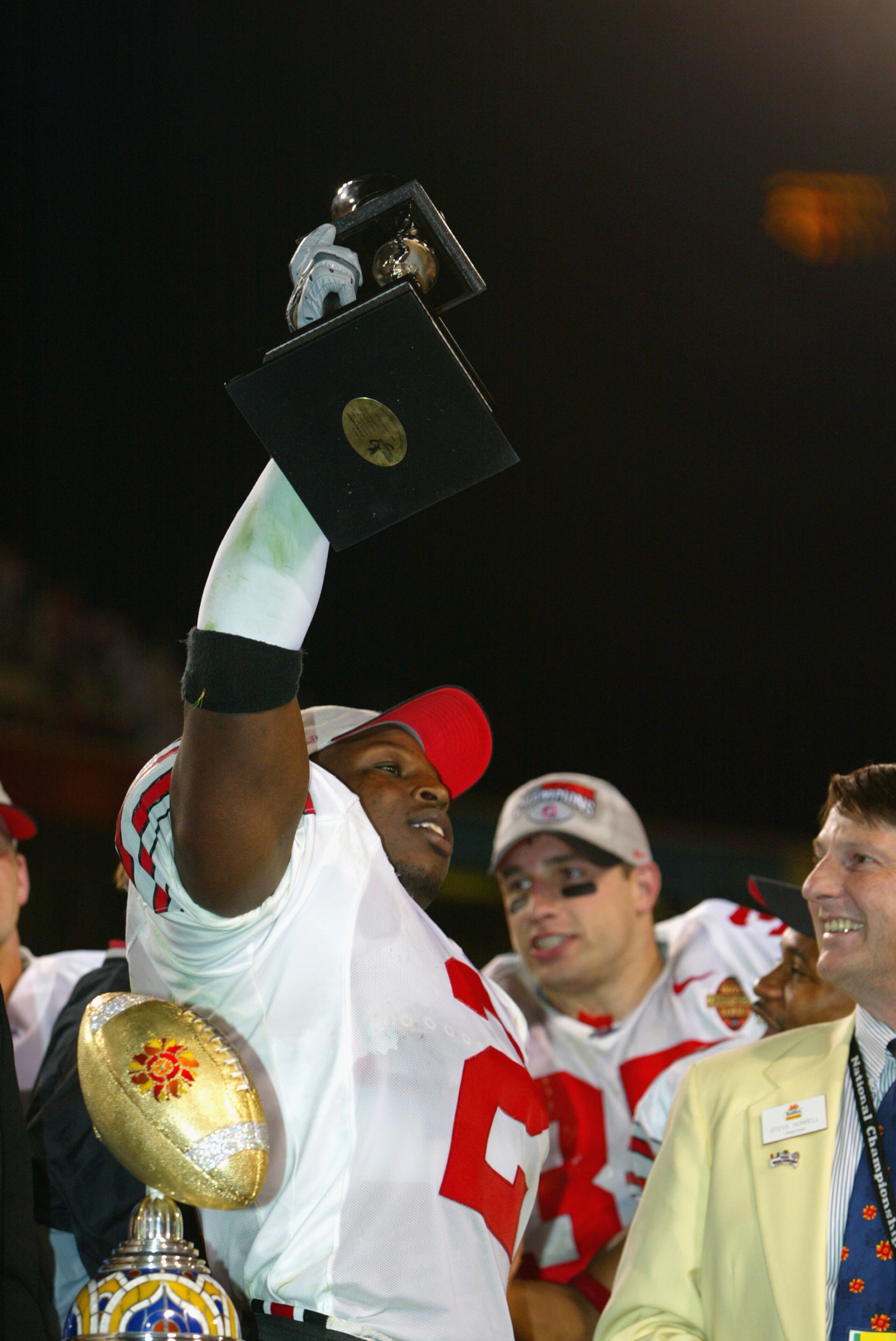 TEMPE, AZ - JANUARY 3:  Safety Michael Doss #2 of the Ohio State Buckeyes holds the defensive MVP trophy after defeating the Miami Hurricanes in the Tostitos Fiesta Bowl on January 3, 2003 at Sun Devil Stadium in Tempe, Arizona.  Ohio State won the game 3