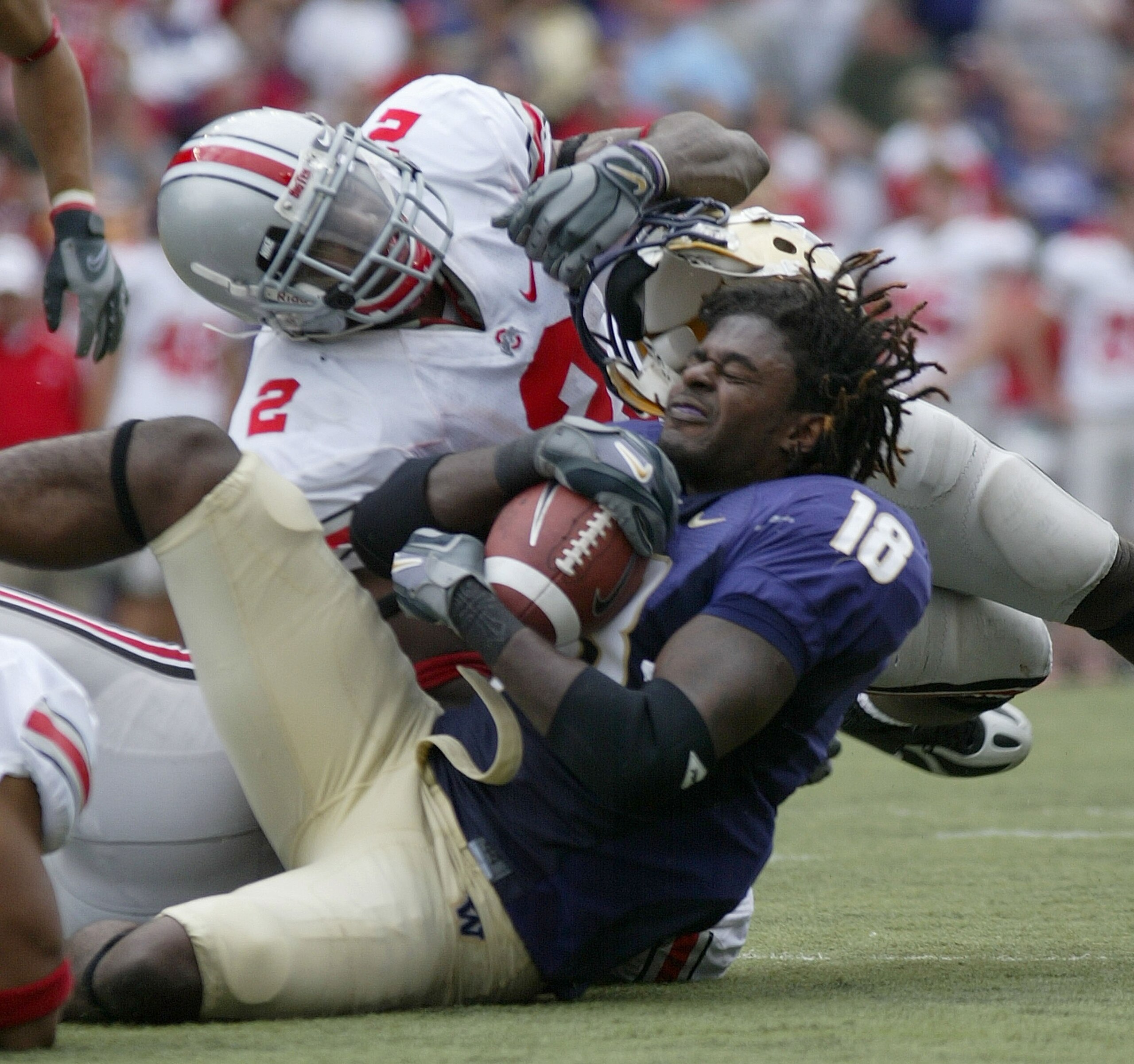 SEATTLE - SEPTEMBER 15:  Wide receiver Corey Williams #18 of the Washington Huskies loses his helmet against Malcolm Jenkins #2 of the Ohio State Buckeyes at Husky Stadium on September 15, 2007 in Seattle, Washington. The Buckeyes defeated the Huskies 33-