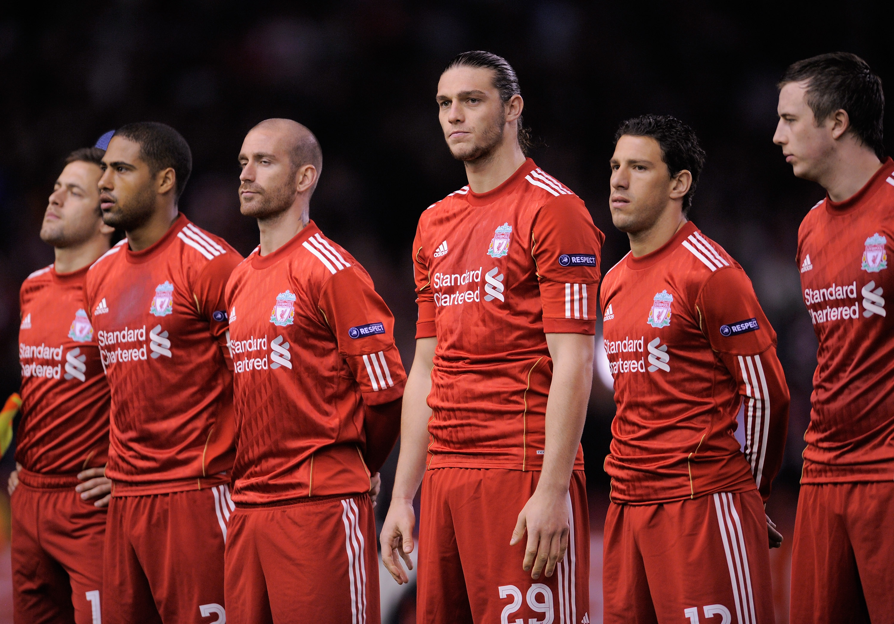 LIVERPOOL, ENGLAND - MARCH 17:  Andy Carroll of Liverpool (C) lines up with his team mates ahead of  the UEFA Europa League Round of 16 second leg match between Liverpool and SC Braga at Anfield on March 17, 2011 in Liverpool, England.  (Photo by Michael
