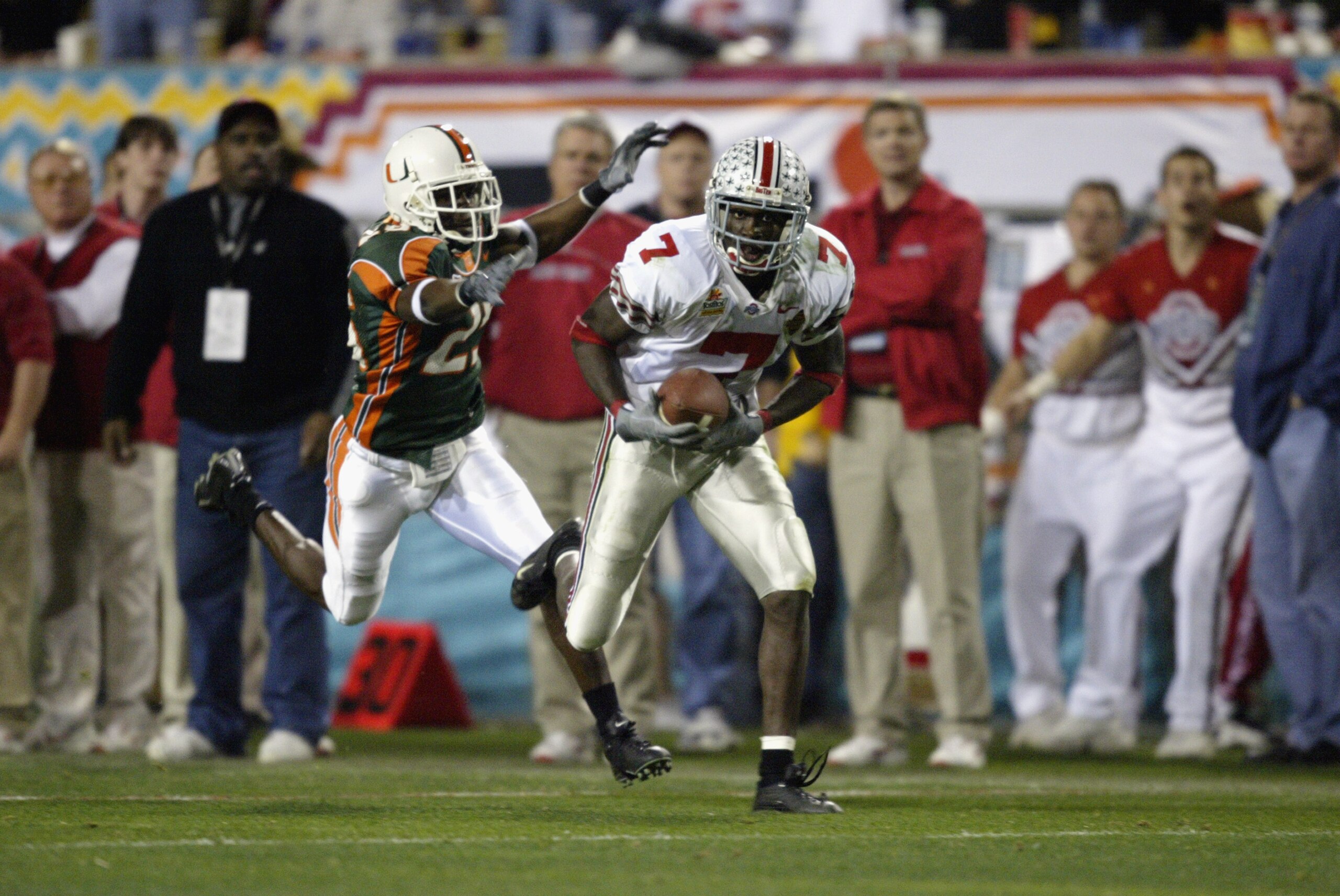 TEMPE, AZ - JANUARY 3:  Receiver Chris Gamble #7 of the Ohio State Buckeyes catches a long pass on defensive back Alfonso Marshall #25 of the Miami Hurricanes in the third quarter during the Tostitos Fiesta Bowl on January 3, 2003 at Sun Devil Stadium in