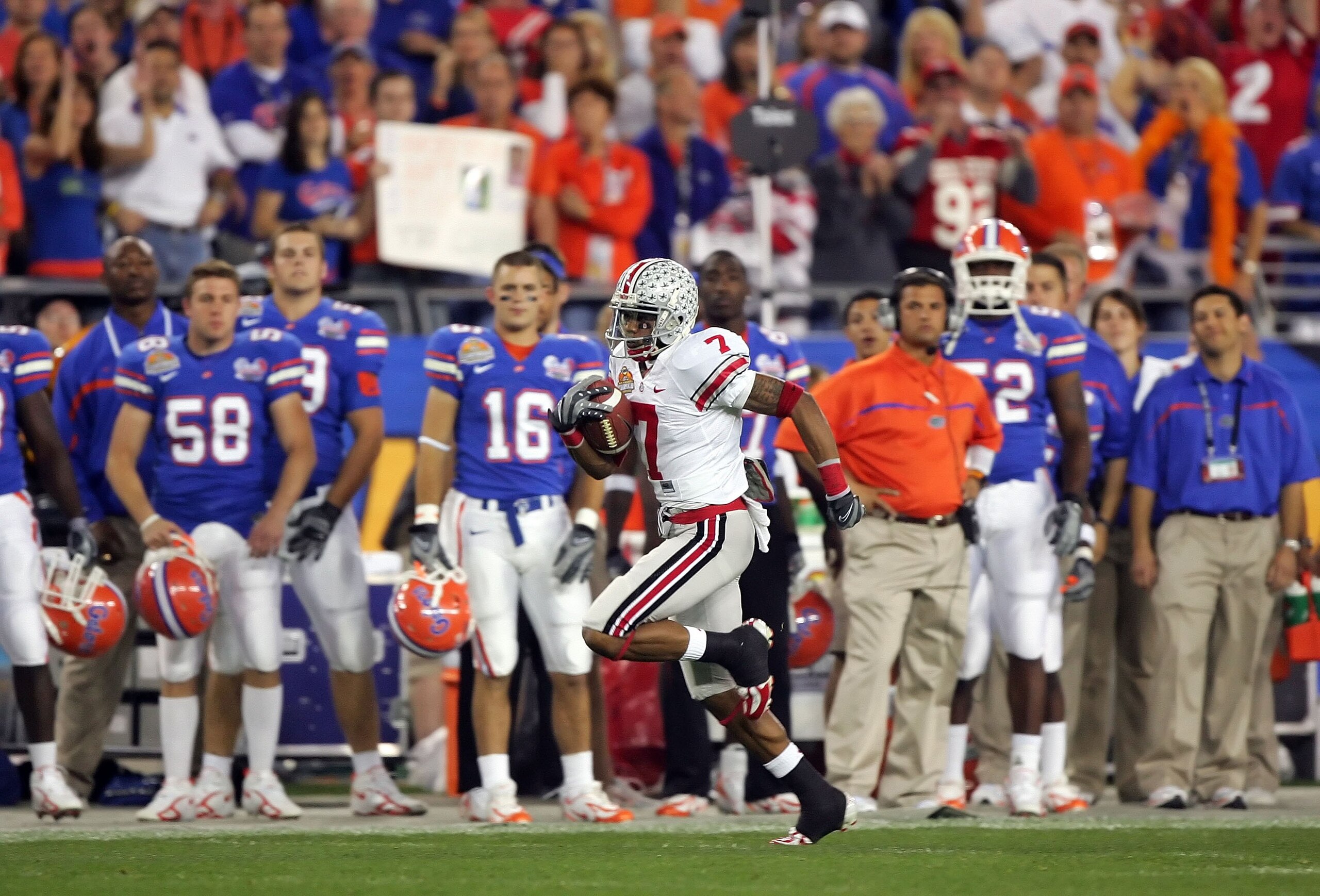 GLENDALE, AZ - JANUARY 08:  Ted Ginn Jr. #7 of the Ohio State Buckeyes returns the opening kickoff for a 93 yard touchdown run against the Florida Gators during the 2007 Tostitos BCS National Championship Game at the University of Phoenix Stadium on Janua