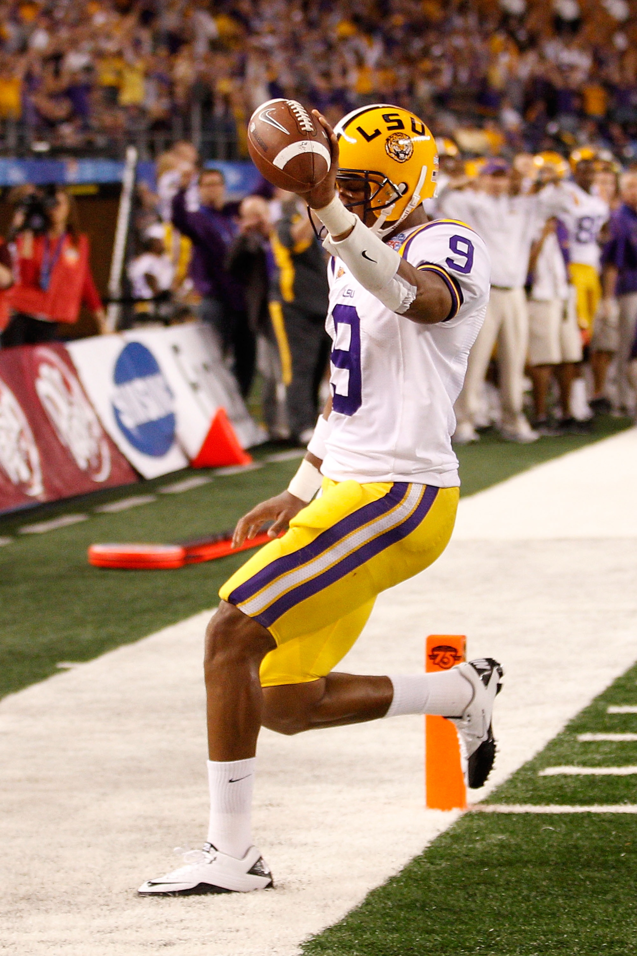 ARLINGTON, TX - JANUARY 07:  Jordan Jefferson #9 of the Louisiana State University Tigers celebrates after scoring a touchdown during the game against the Texas A&M Aggies during the AT&T Cotton Bowl at Cowboys Stadium on January 7, 2011 in Arlington, Tex