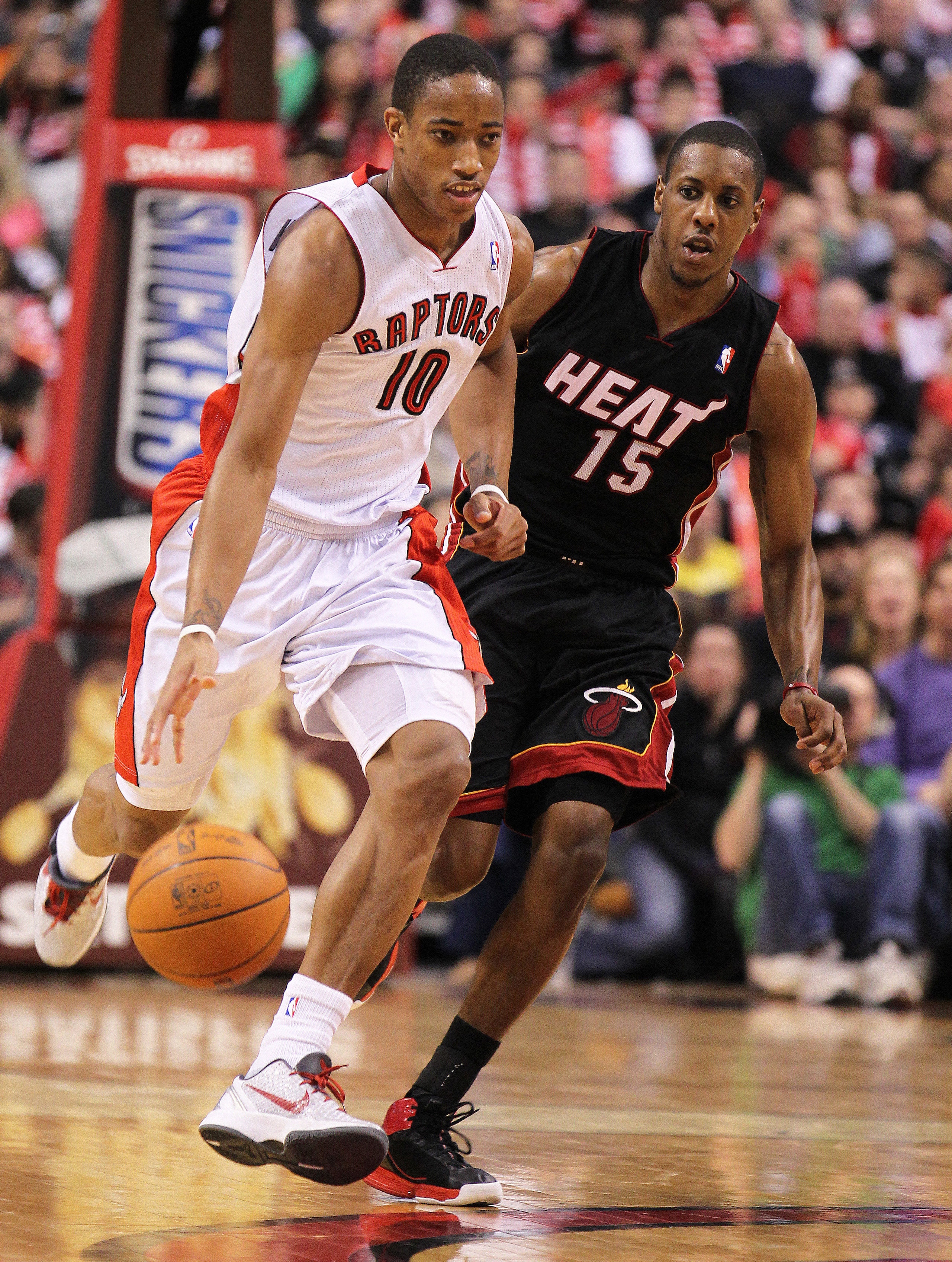 TORONTO, CANADA - FEBRUARY 16:  DeMar DeRozan #10 of the Toronto Raptors drives back up court while being covered by Mario Chalmers #15 of the Miami Heat in a game on February 16, 2011 at the Air Canada Centre in Toronto, Canada. The Heat defeated the Rap