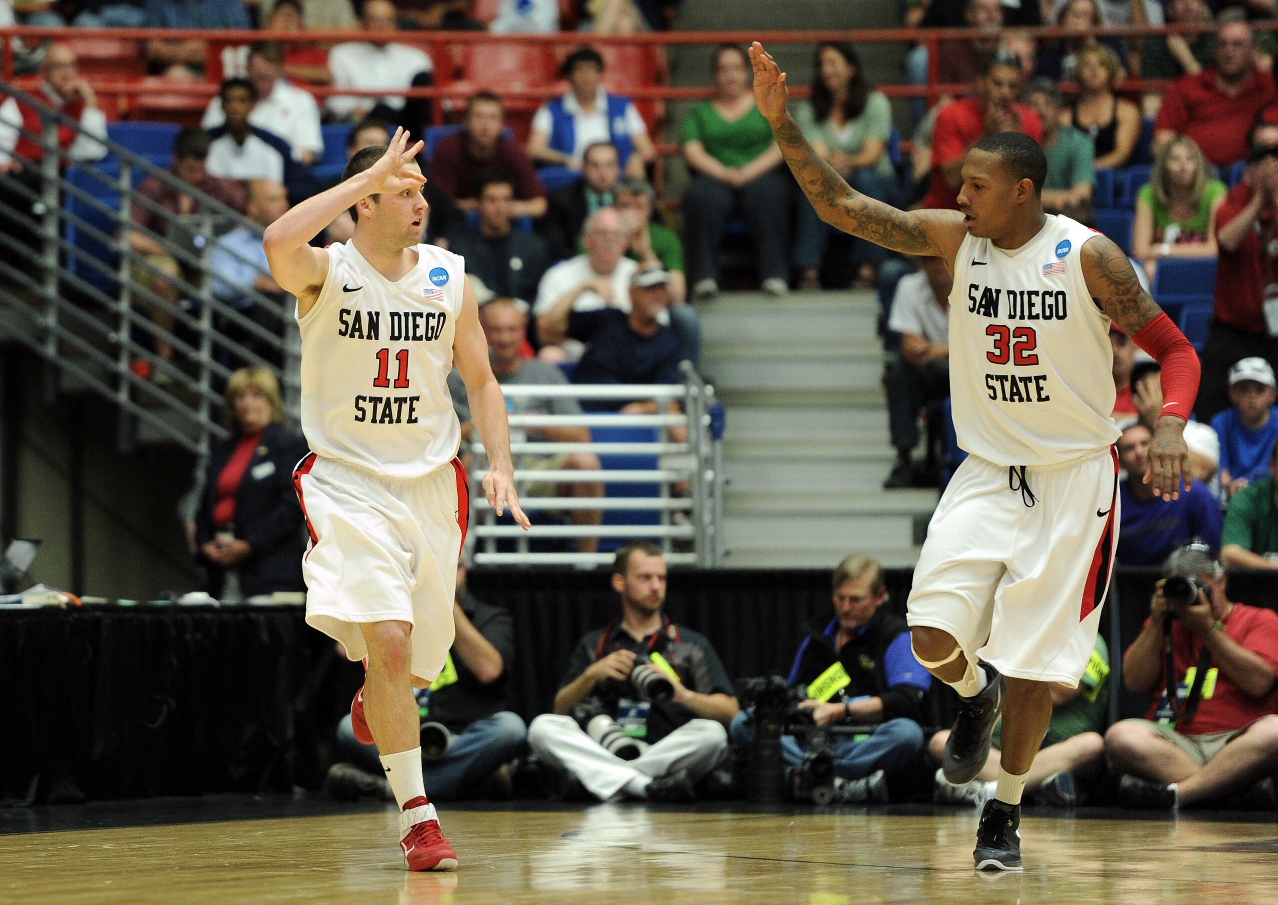 TUCSON, AZ - MARCH 17:  James Rahon #11 of the San Diego State Aztecs celebrates sinking a three-pointer with teammate Billy White #32 against the Northern Colorado Bears during the second round of the 2011 NCAA men's basketball tournament at McKale Cente