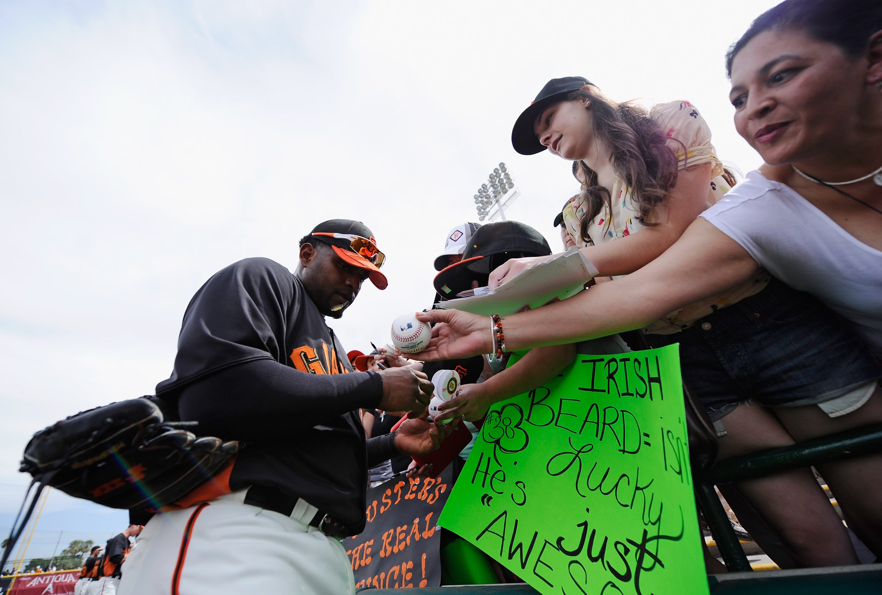 SCOTTSDALE, AZ - MARCH 14: Pablo Sandoval #48 of the San Francisco Giants autographs baseballs priror to the start of the spring training baseball game against Milwaukee Brewers at Scottsdale Stadium on March 14, 2011 in Scottsdale, Arizona. (Photo by K