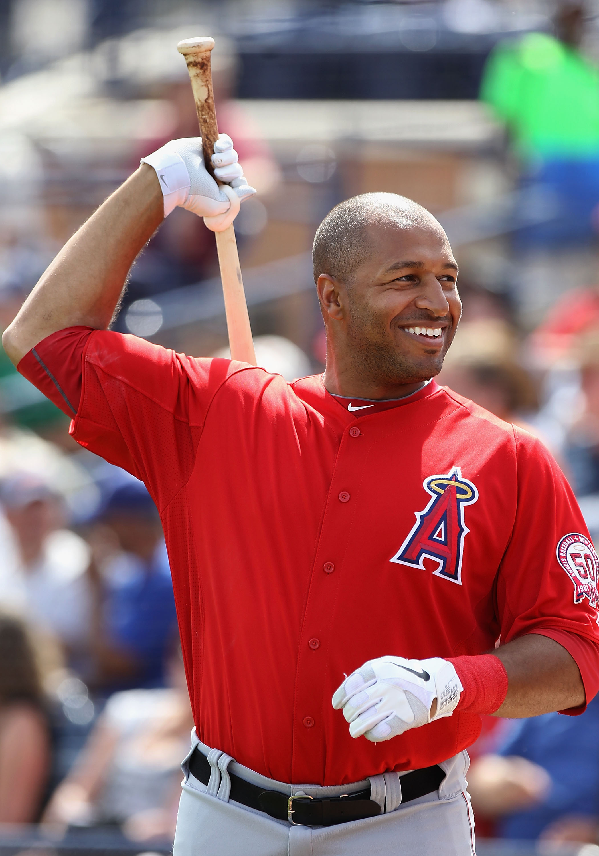 PEORIA, AZ - MARCH 15:  Vernon Wells #10 of the Los Angeles Angels of Anaheim warms up on deck during the spring training game against the San Diego Padres at Peoria Stadium on March 15, 2011 in Peoria, Arizona.  (Photo by Christian Petersen/Getty Images)