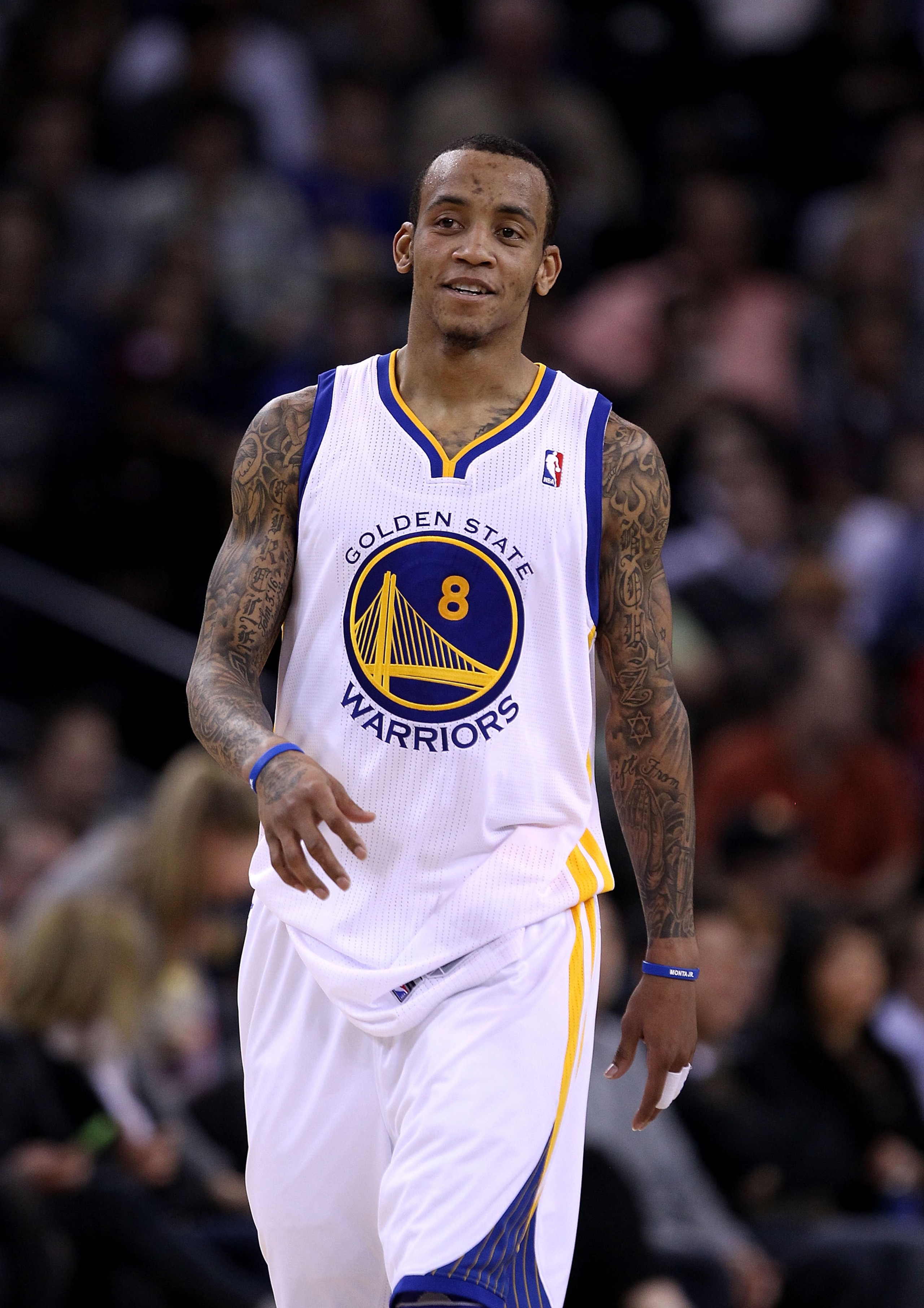 OAKLAND, CA - JANUARY 21:  Monta Ellis #8 of the Golden State Warriors walks back down court during their game against the Sacramento Kings at Oracle Arena on January 21, 2011 in Oakland, California. NOTE TO USER: User expressly acknowledges and agrees th