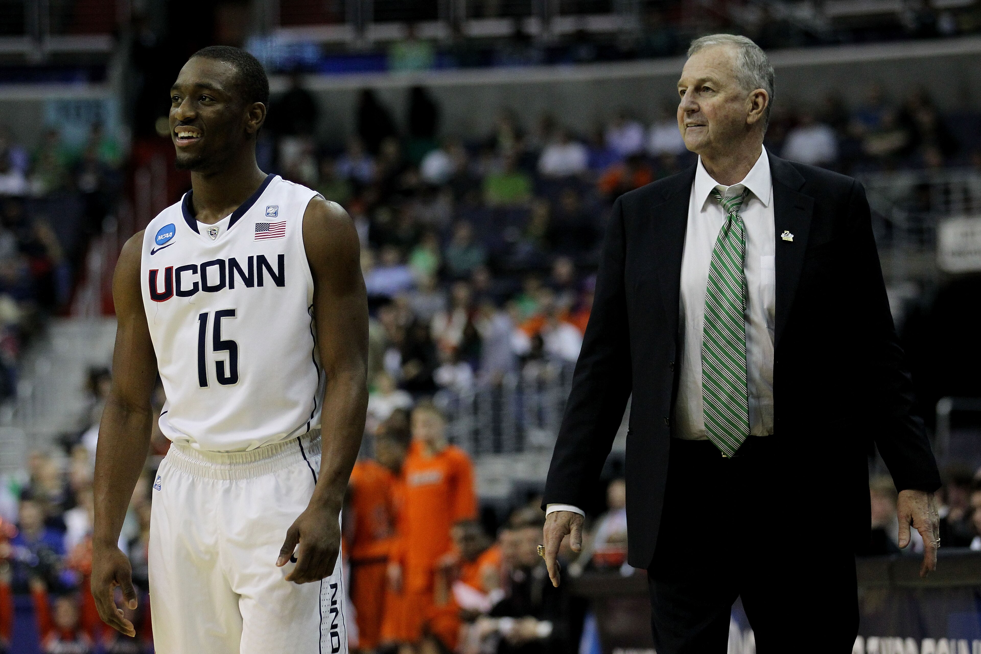 WASHINGTON - MARCH 17:  Head coach Jim Calhoun of the Connecticut Huskies and Kemba Walker #15 smile during their game against the Bucknell Bison during the second round of the 2011 NCAA men's basketball tournament at the Verizon Center on March 17, 2011