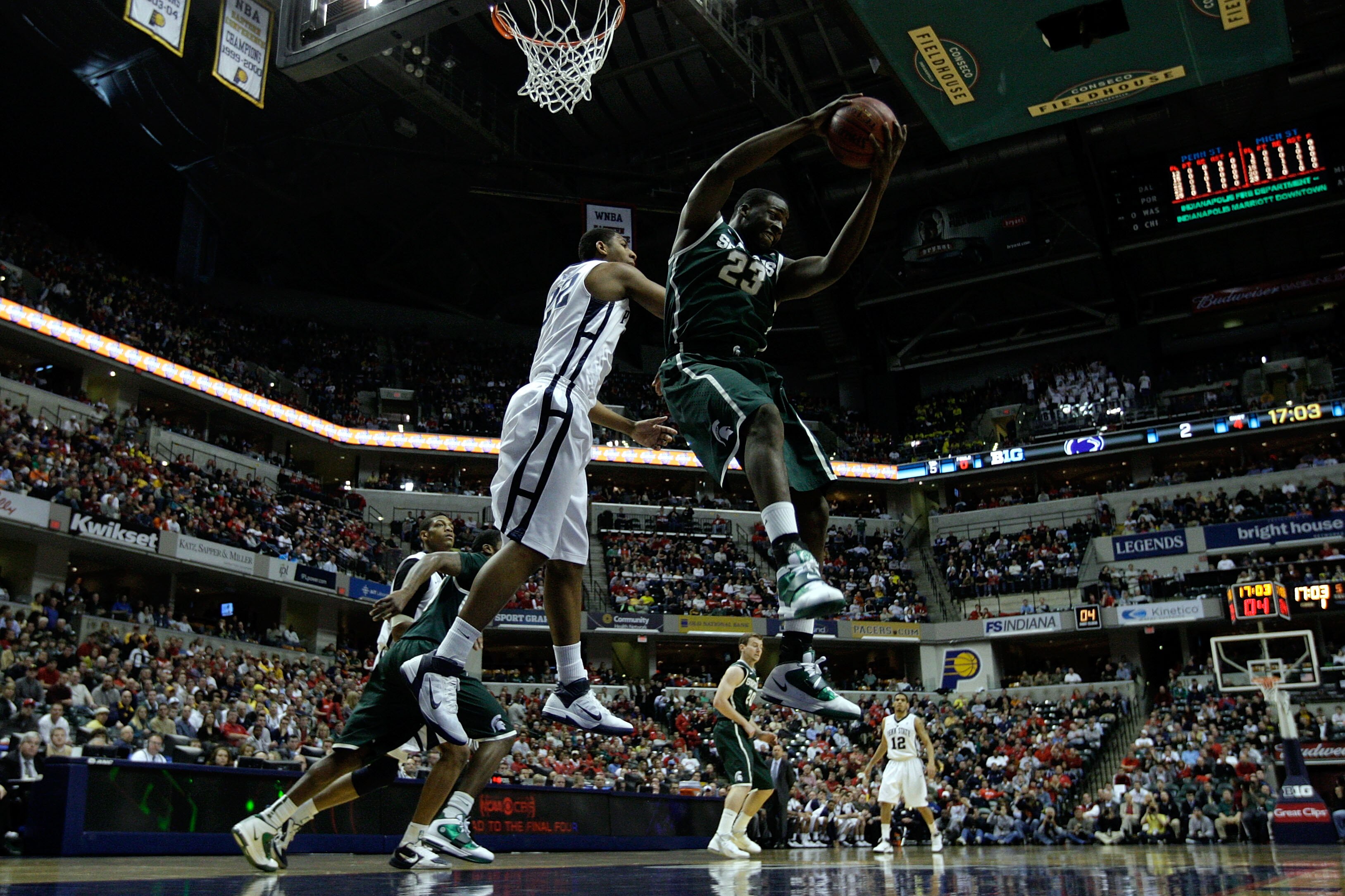 INDIANAPOLIS, IN - MARCH 12: Draymond Green #23 of the Michigan State Spartans controls a rebound against the Penn State Nittany Lions during the semifinals of the 2011 Big Ten Men's Basketball Tournament at Conseco Fieldhouse on March 12, 2011 in Indiana