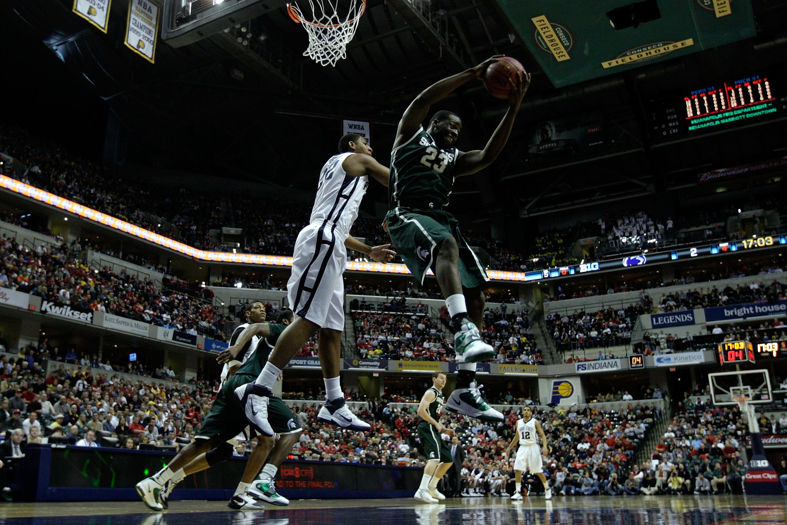 INDIANAPOLIS, IN - MARCH 12: Draymond Green #23 of the Michigan State Spartans controls a rebound against the Penn State Nittany Lions during the semifinals of the 2011 Big Ten Men's Basketball Tournament at Conseco Fieldhouse on March 12, 2011 in Indiana