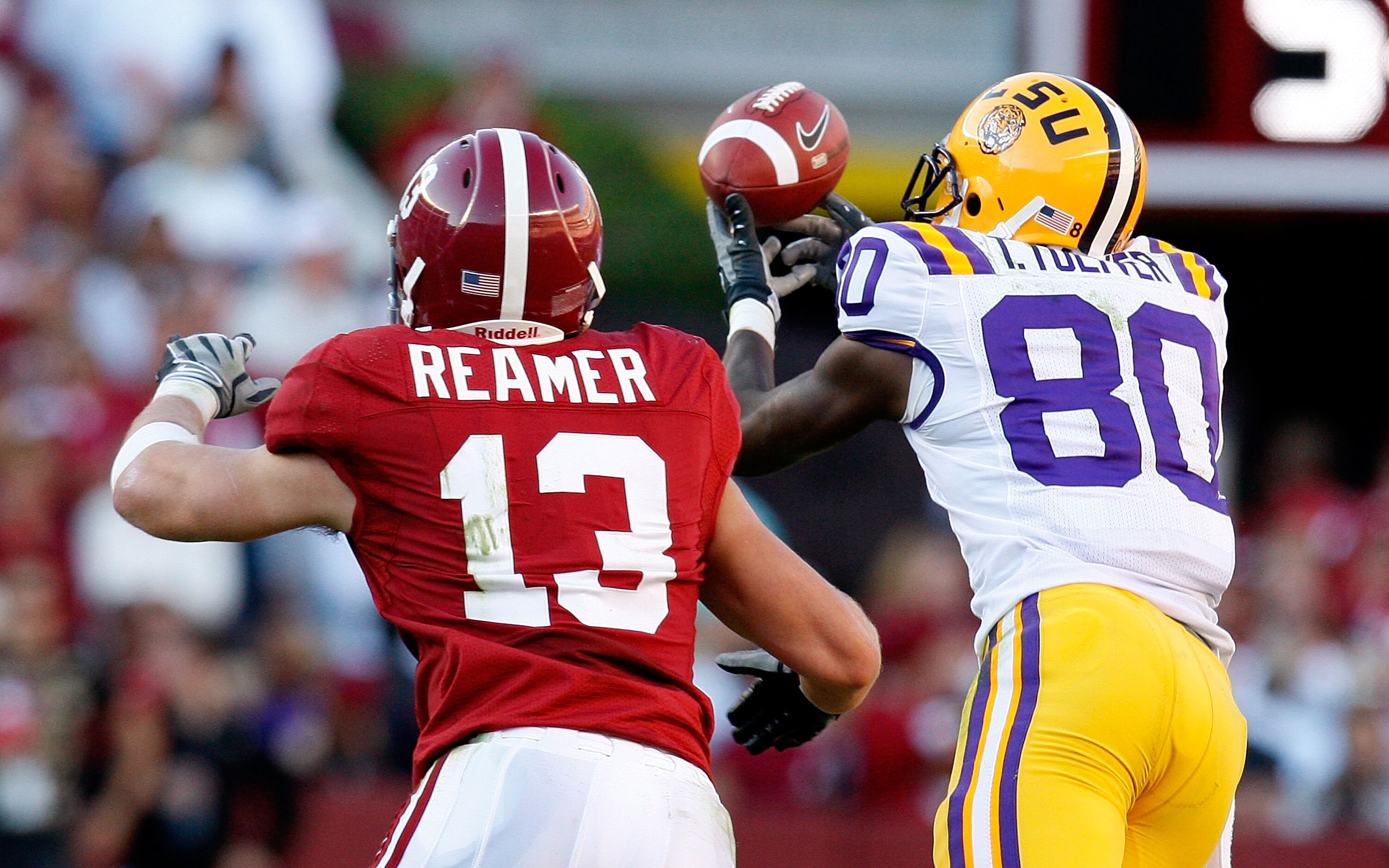 TUSCALOOSA, AL - NOVEMBER 07:  Terrance Toliver #80 of the Louisiana State University Tigers fails to pull in this reception against Cory Reamer #13 of the Alabama Crimson Tide at Bryant-Denny Stadium on November 7, 2009 in Tuscaloosa, Alabama.  (Photo by