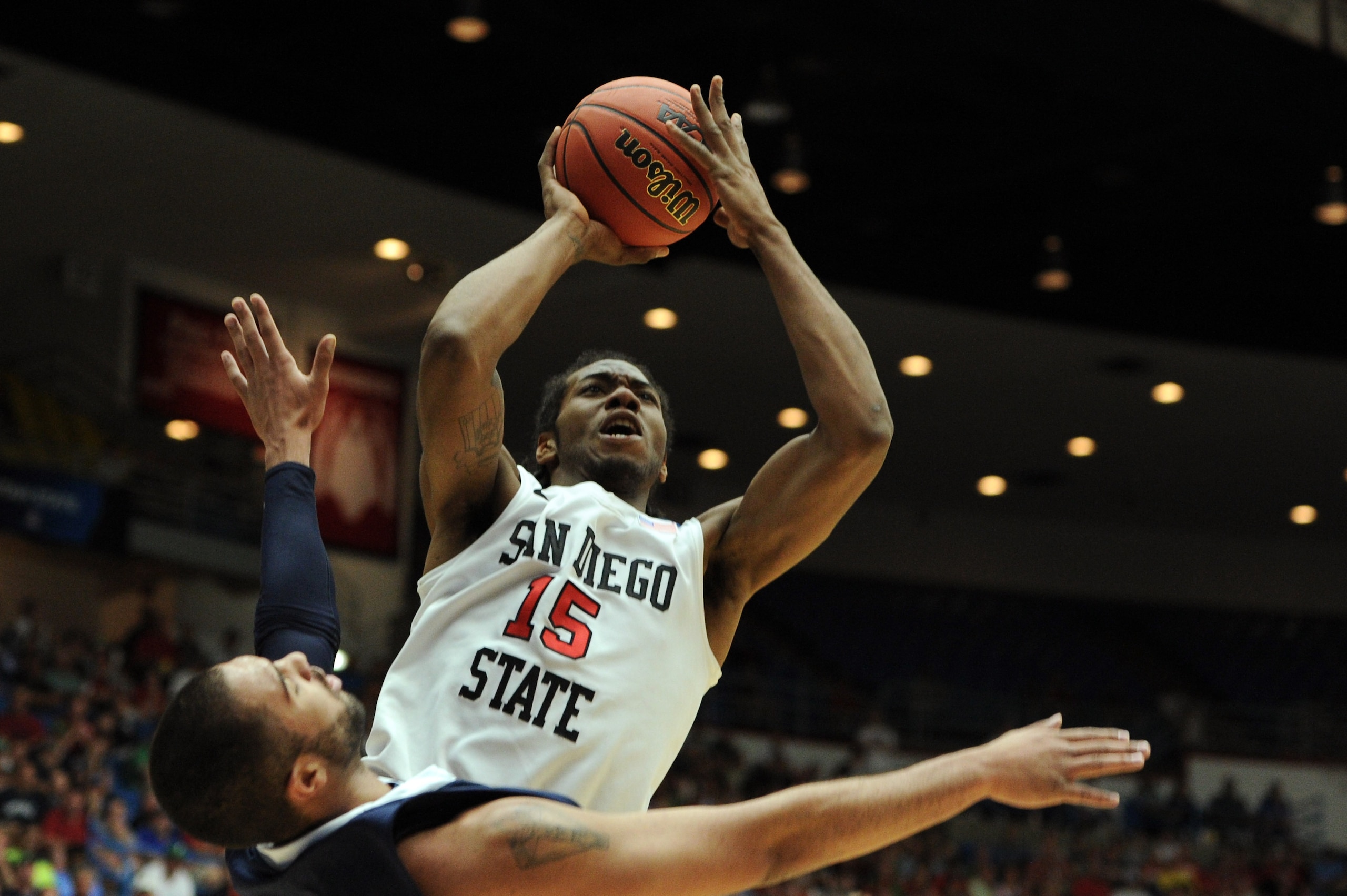 TUCSON, AZ - MARCH 17:  Kawhi Leonard #15 of the San Diego State Aztecs shoots over Taylor Montgomery #44 of the Northern Colorado Bears during the second round of the 2011 NCAA men's basketball tournament at McKale Center on March 17, 2011 in Tucson, Ari