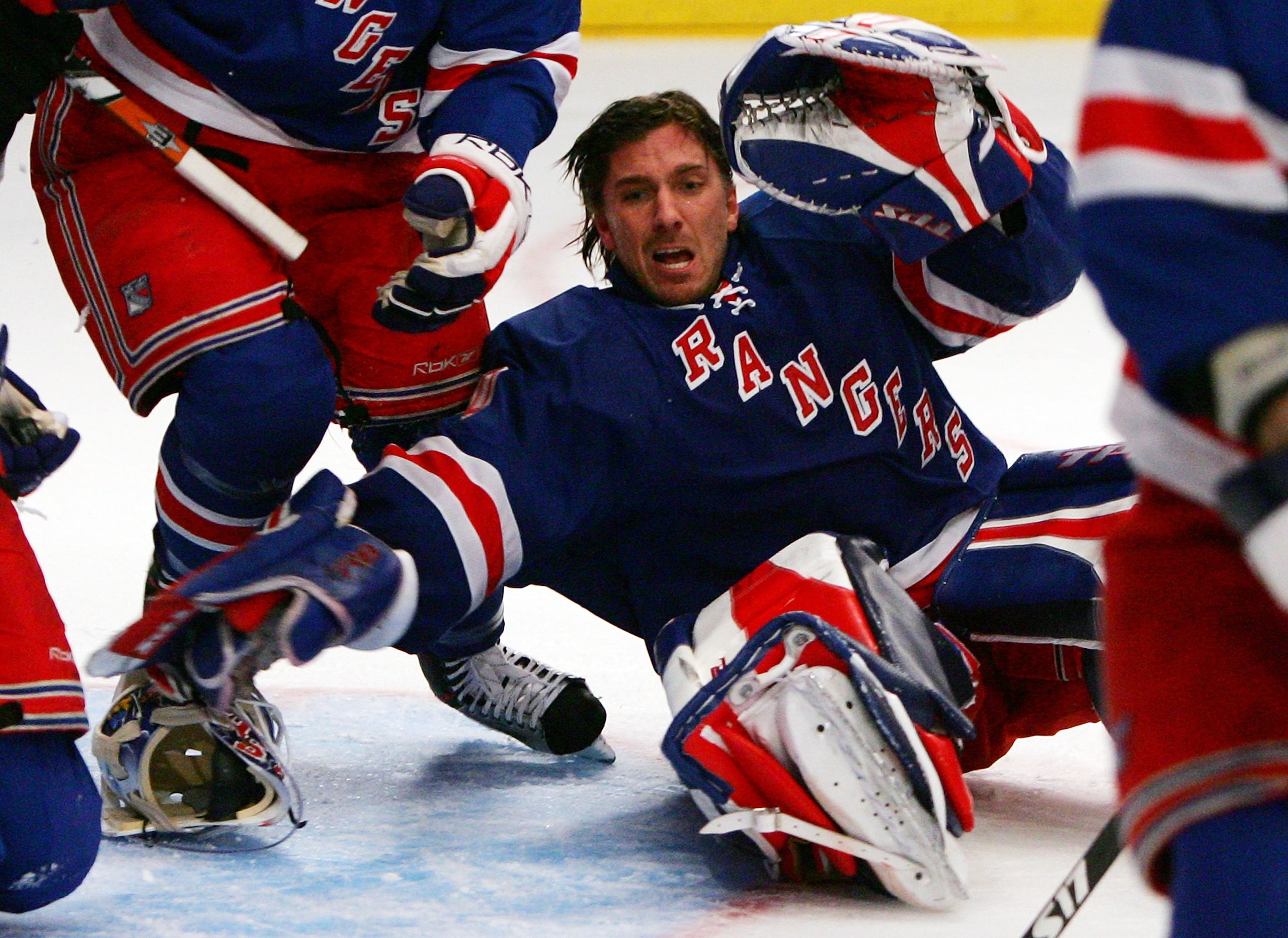 NEW YORK - FEBRUARY 17: Henrik Lundqvist #30 of the New York Rangers defends his net against the San Jose Sharks despite losing his mask on February 17, 2008 at Madison Square Garden in New York City. The Rangers won the game 3-1. (Photo by Jim McIsaac/ NEW YORK - FEBRUARY 17: Henrik Lundqvist #30 of the New York Rangers defends his net against the San Jose Sharks despite losing his mask on February 17, 2008 at Madison Square Garden in New York City. The Rangers won the game 3-1. (Photo by Jim McIsaac/