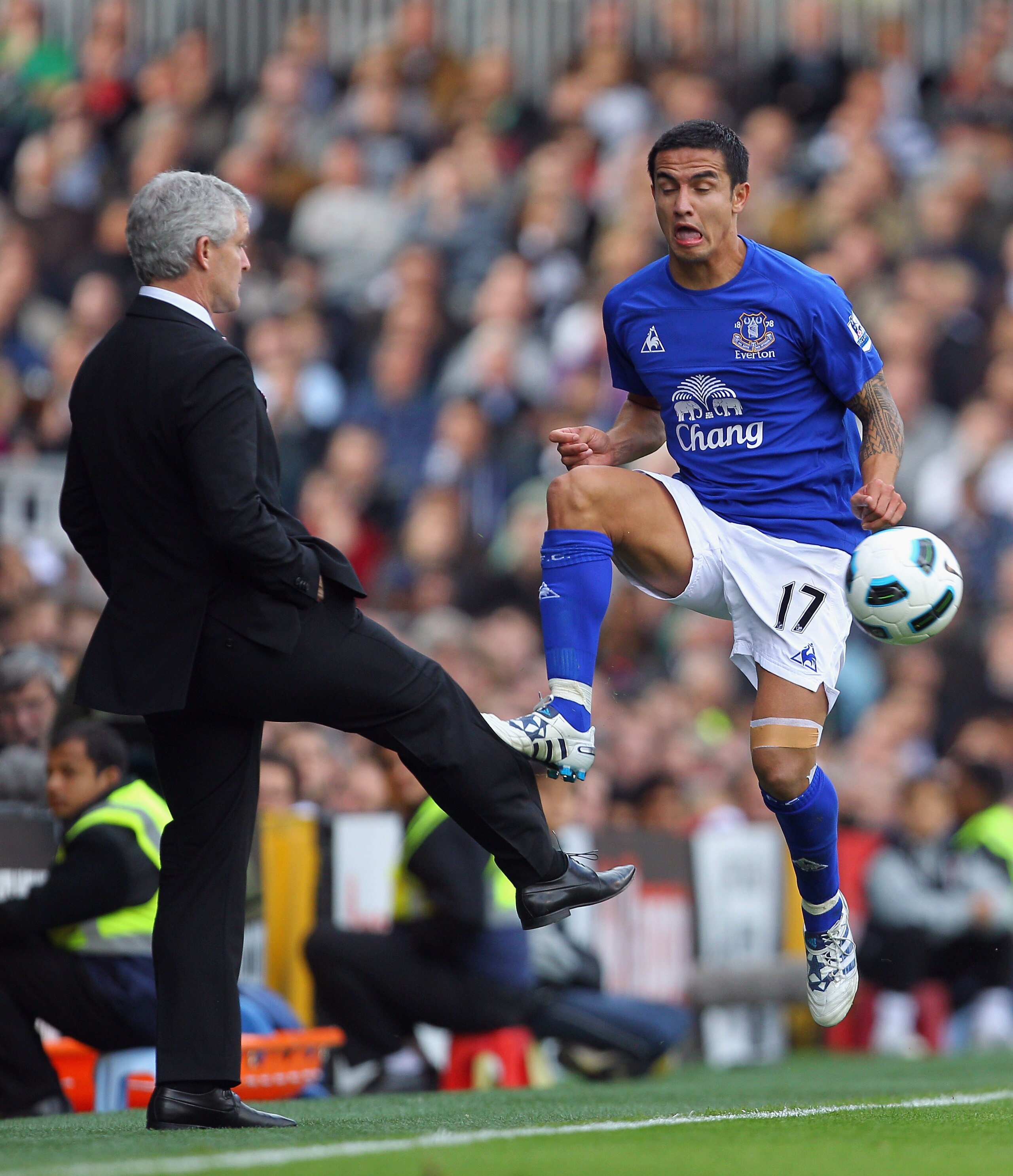 LONDON, ENGLAND - SEPTEMBER 25:  Mark Hughes of Fulham controls the ball on the touchline from Tim Cahill of Everton during the Barclays Premier League match between Fulham and Everton at Craven Cottage on September 25, 2010 in London, England.  (Photo by