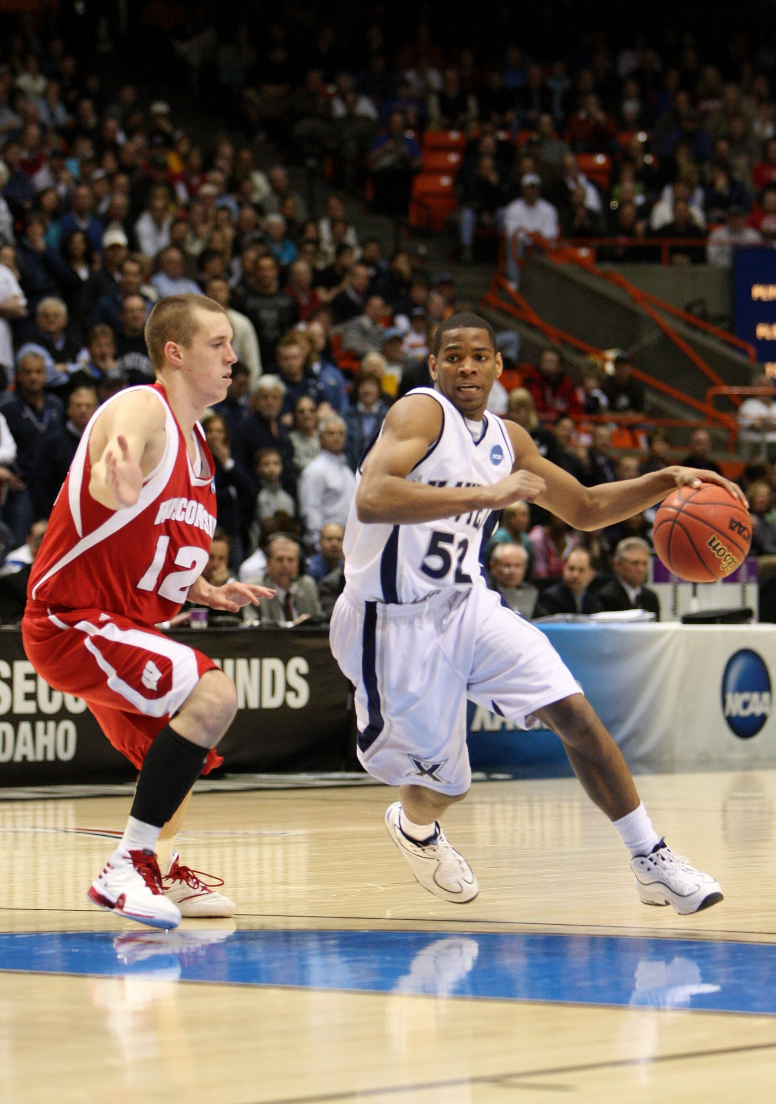 BOISE, ID - MARCH 22:  Guard Terrell Holloway #52 of the Xavier Musketeers drives with the ball against the Wisconsin Badgers during the second round of the NCAA Division I Men's Basketball Tournament at the Taco Bell Arena on March 22, 2009 in Boise, Ida