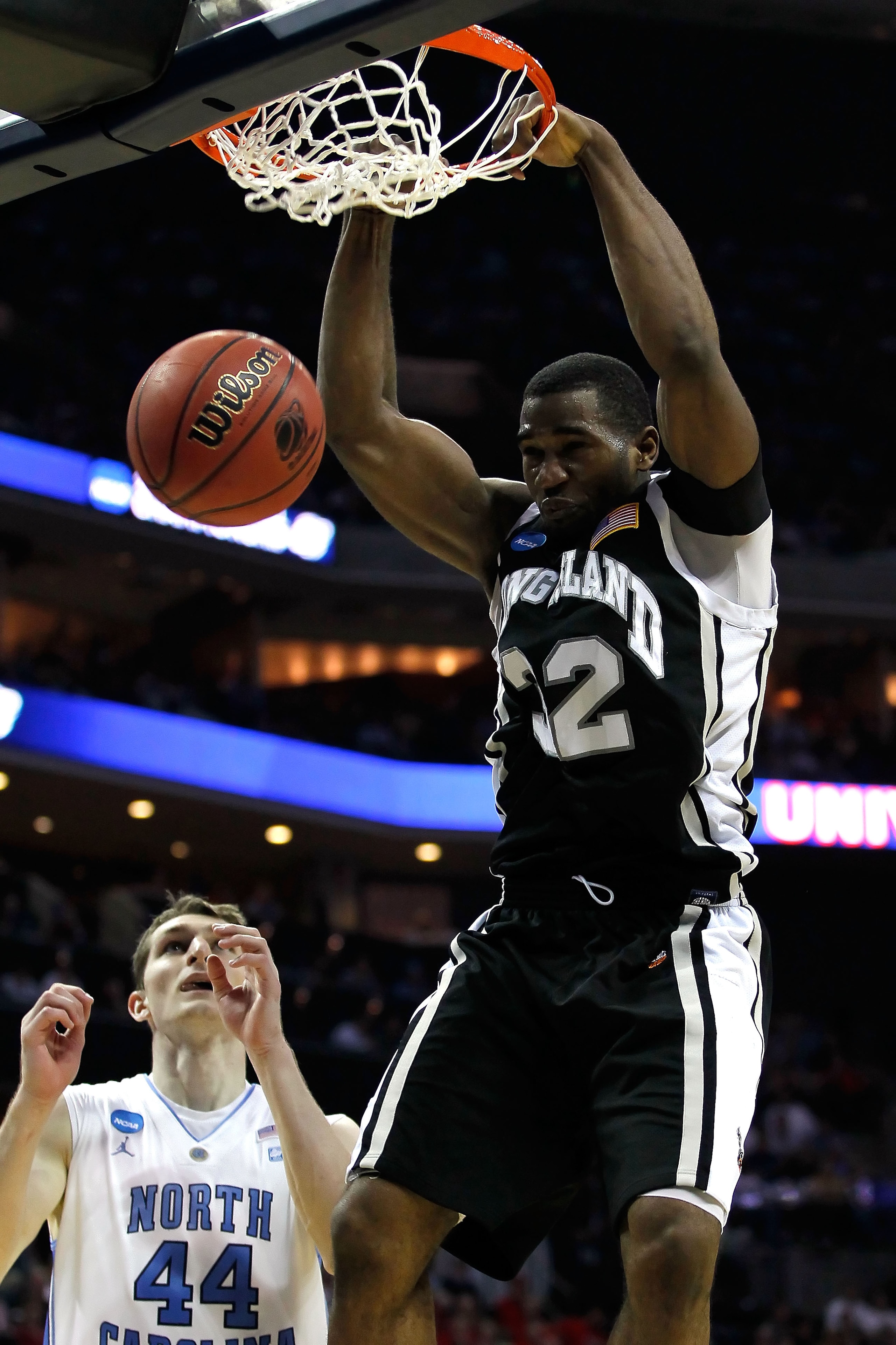 CHARLOTTE, NC - MARCH 18:  Kenny Onyechi #32 of the Long Island Blackbirds dunks the ball over Tyler Zeller #44 of the North Carolina Tar Heels in the second half during the second round of the 2011 NCAA men's basketball tournament at Time Warner Cable Ar