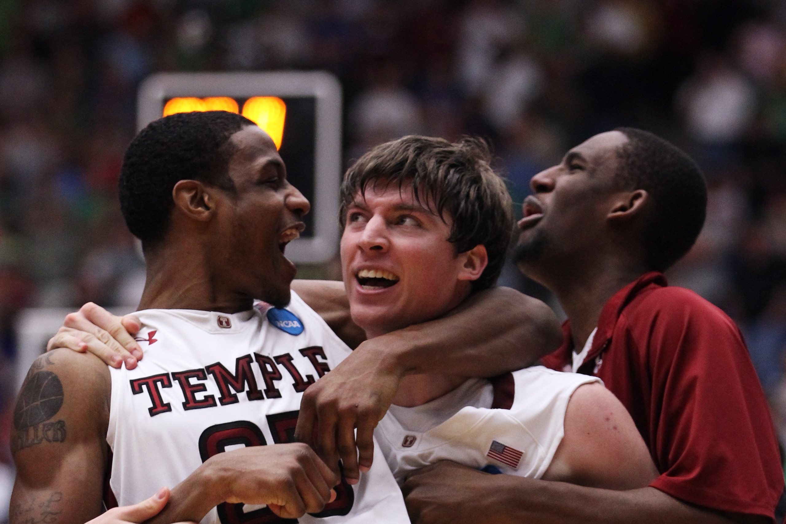 TUCSON, AZ - MARCH 17:  Juan Fernandez #4 celebrates with Lavoy Allen #24 of the Temple Owls after scoring the winning basket to defeat the Penn State Nittany Lions 66 to 64 in the second round of the 2011 NCAA men's basketball tournament at McKale Center