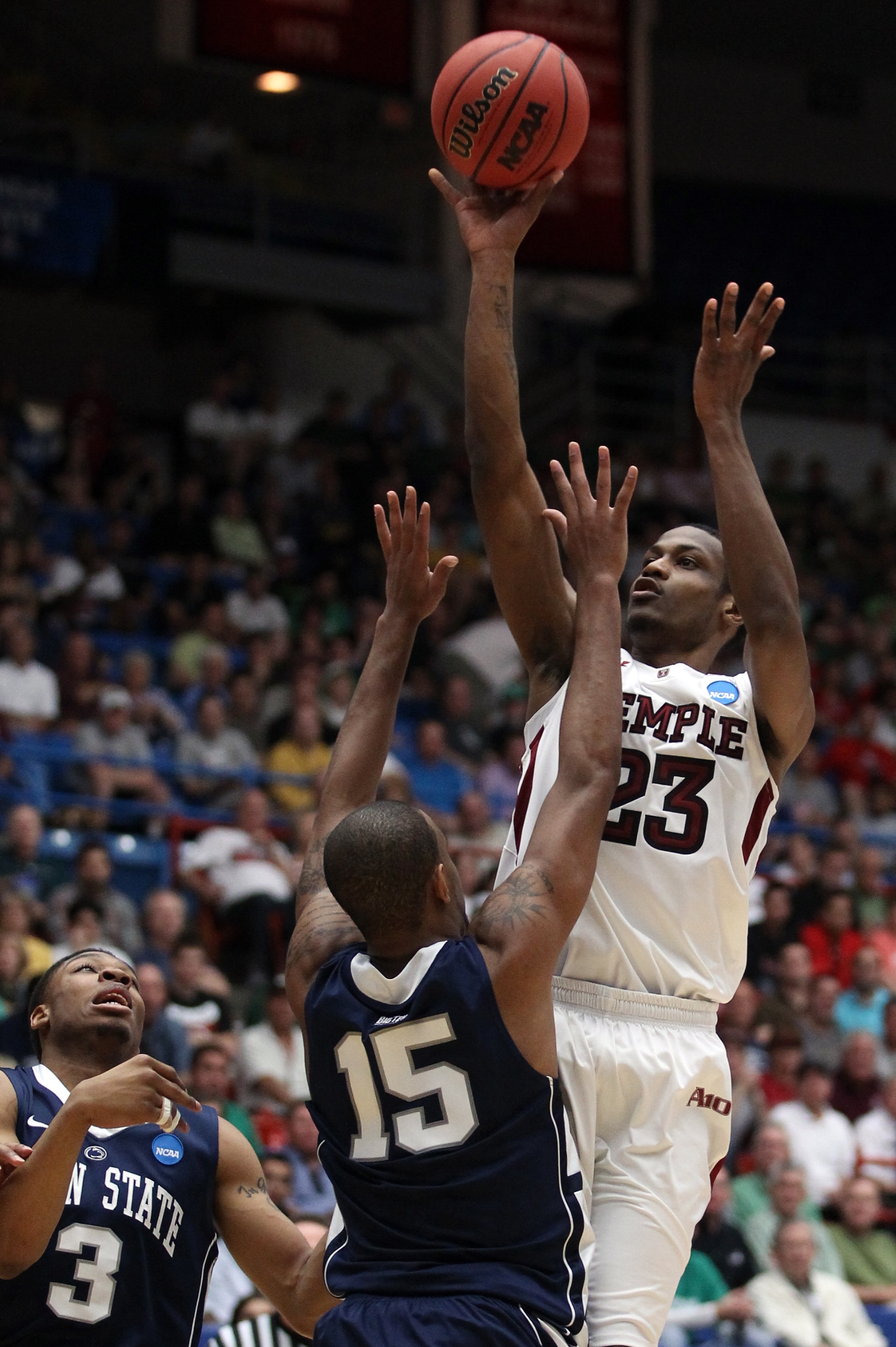 TUCSON, AZ - MARCH 17:  Ramone Moore #23 of the Temple Owls shoots over David Jackson #15 and Jermaine Marshall #3 of the Penn State Nittany Lions during the second round of the 2011 NCAA men's basketball tournament at McKale Center on March 17, 2011 in T