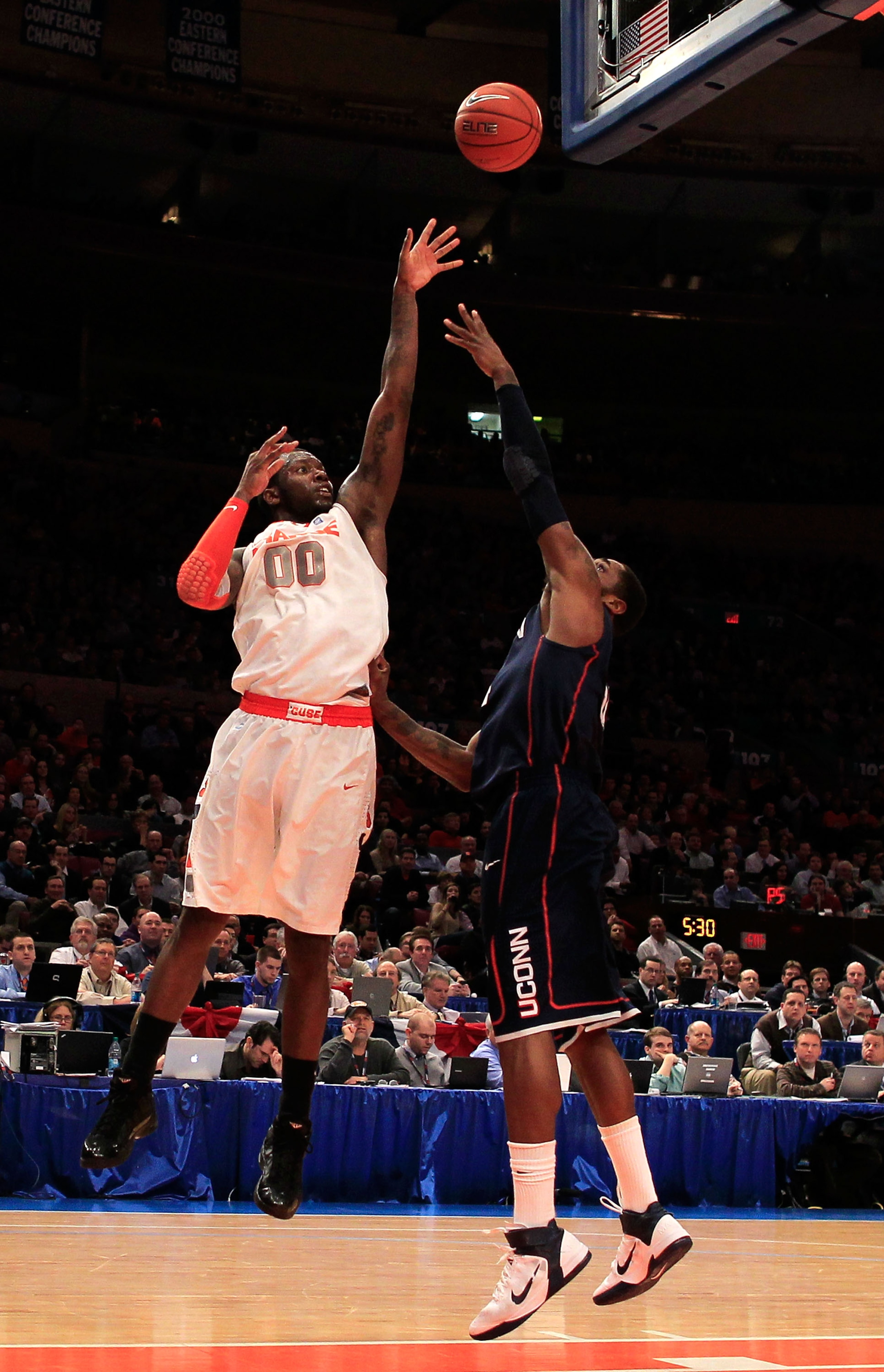NEW YORK, NY - MARCH 11: Rick Jackson #0 of the Syracuse Orange shoots over Alex Oriakhi #34 of the Connecticut Huskies during the semifinals of the 2011 Big East Men's Basketball Tournament presented by American Eagle Outfitters at Madison Square Garden NEW YORK, NY - MARCH 11: Rick Jackson #0 of the Syracuse Orange shoots over Alex Oriakhi #34 of the Connecticut Huskies during the semifinals of the 2011 Big East Men's Basketball Tournament presented by American Eagle Outfitters at Madison Square Garden