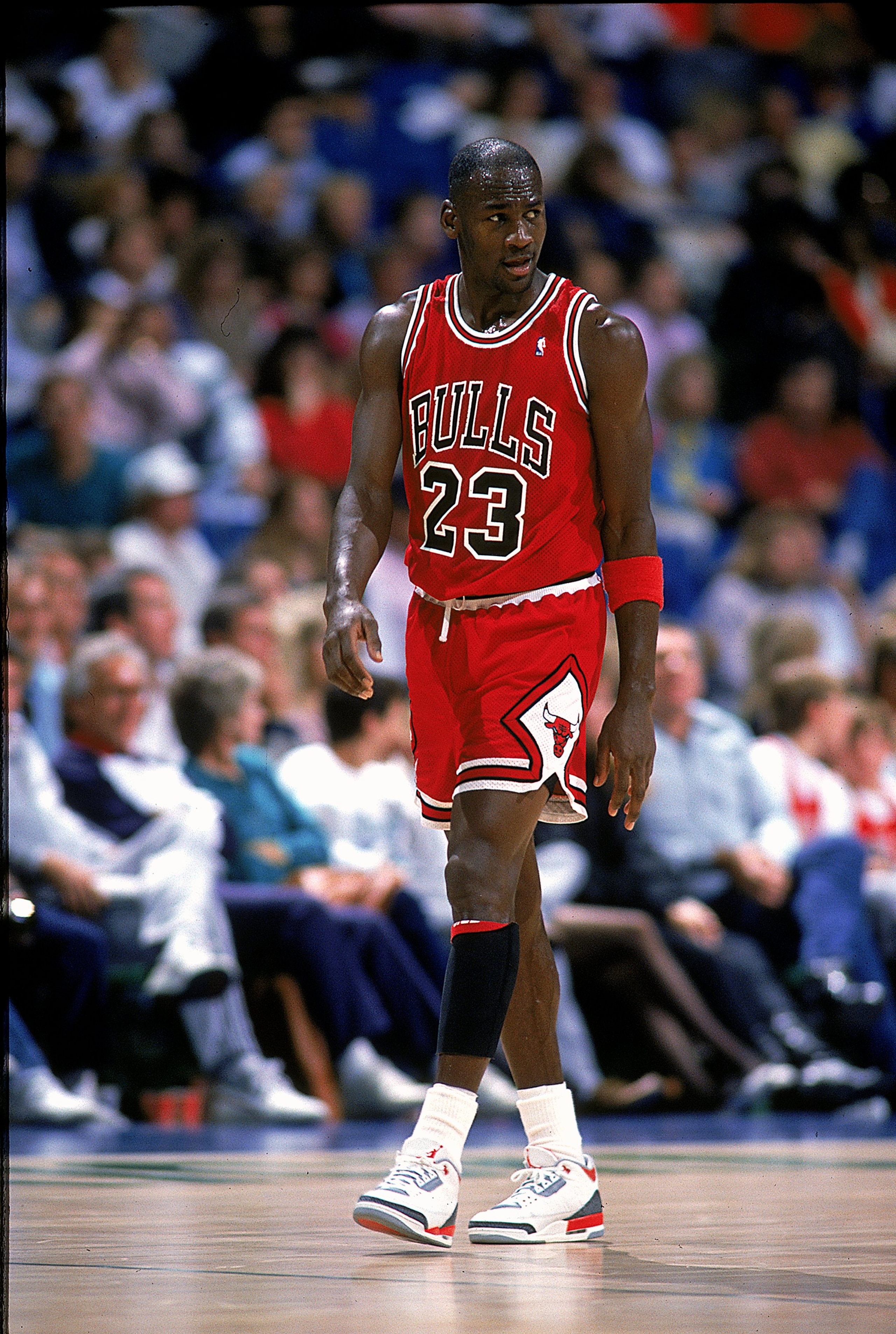 1989:  Michael Jordan #23 of the Chicago Bulls walks and looks on from the court during the game.   Mandatory Credit: Joe Patronite  /Allsport