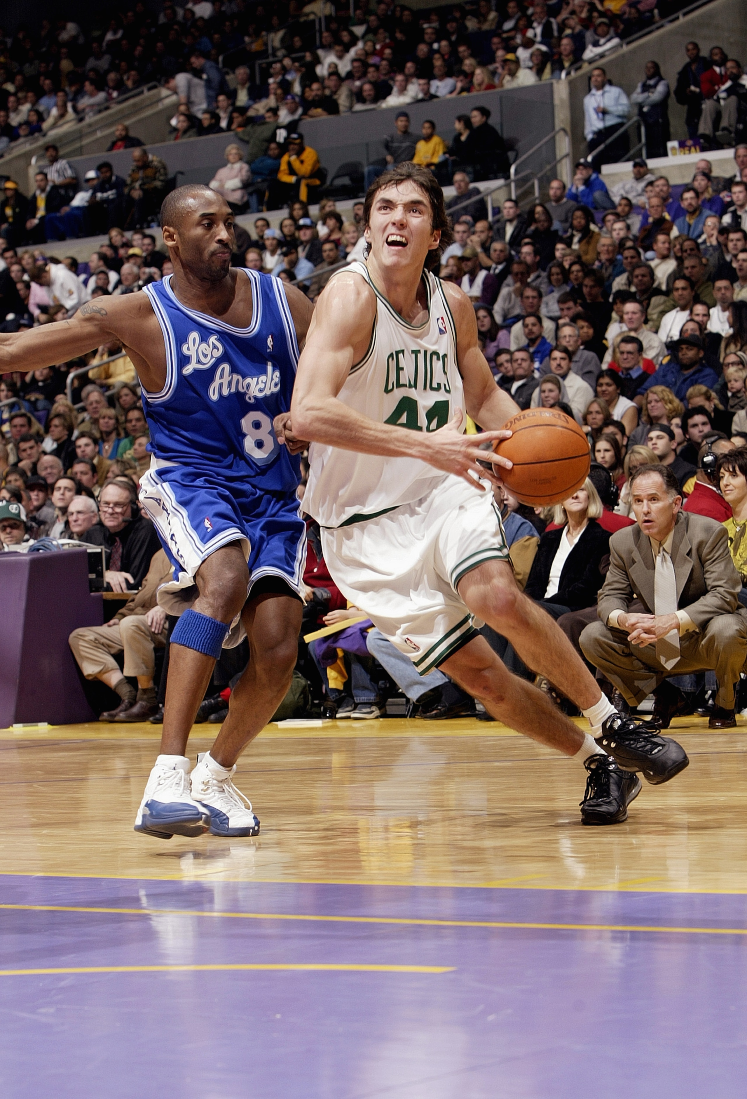 LOS ANGELES - DECEMBER 28:  Jiri Welsch #44 of the Boston Celtics drives to the hoop past Kobe Bryant #8 of the Los Angeles Lakers during the game at Staples Center on December 28, 2003 in Los Angeles, California.  The Lakers won 105-82.  NOTE TO USER: Us
