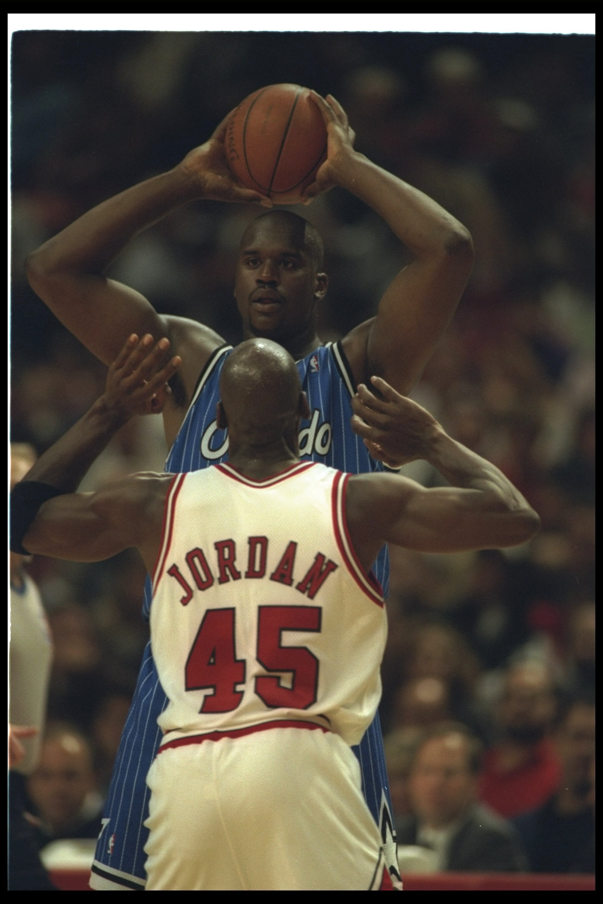 24 Mar 1995:  Center Shaquille O''Neal of the Orlando Magic looks to pass the ball as Chicago Bulls guard Michael Jordan covers him during a game at the United Center in Chicago, Illinois.  The Magic won the game, 106-99. Mandatory Credit: Jonathan Daniel