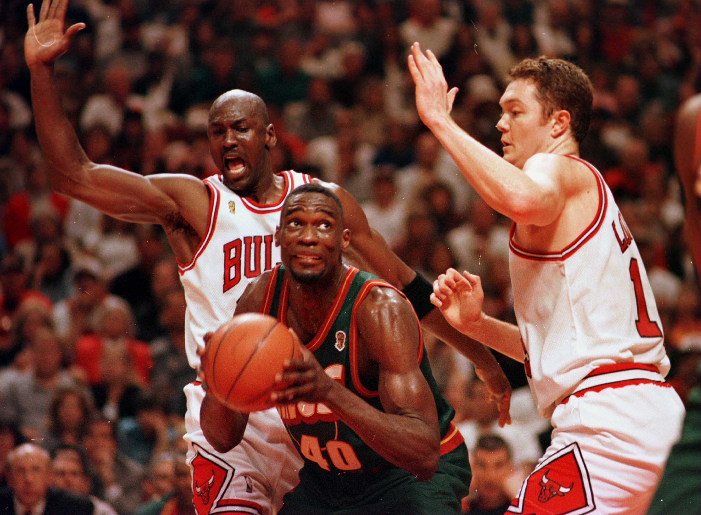 16 Jun 1996: Seattle Supersonic Shawn Kemp works to the basket between Chicago Bulls Michael Jordan and Luc Longley during fourth quarter action of game six of the NBA Finals at the United Center in Chicago, Illinois. The Bulls went on to defeat the Seatt